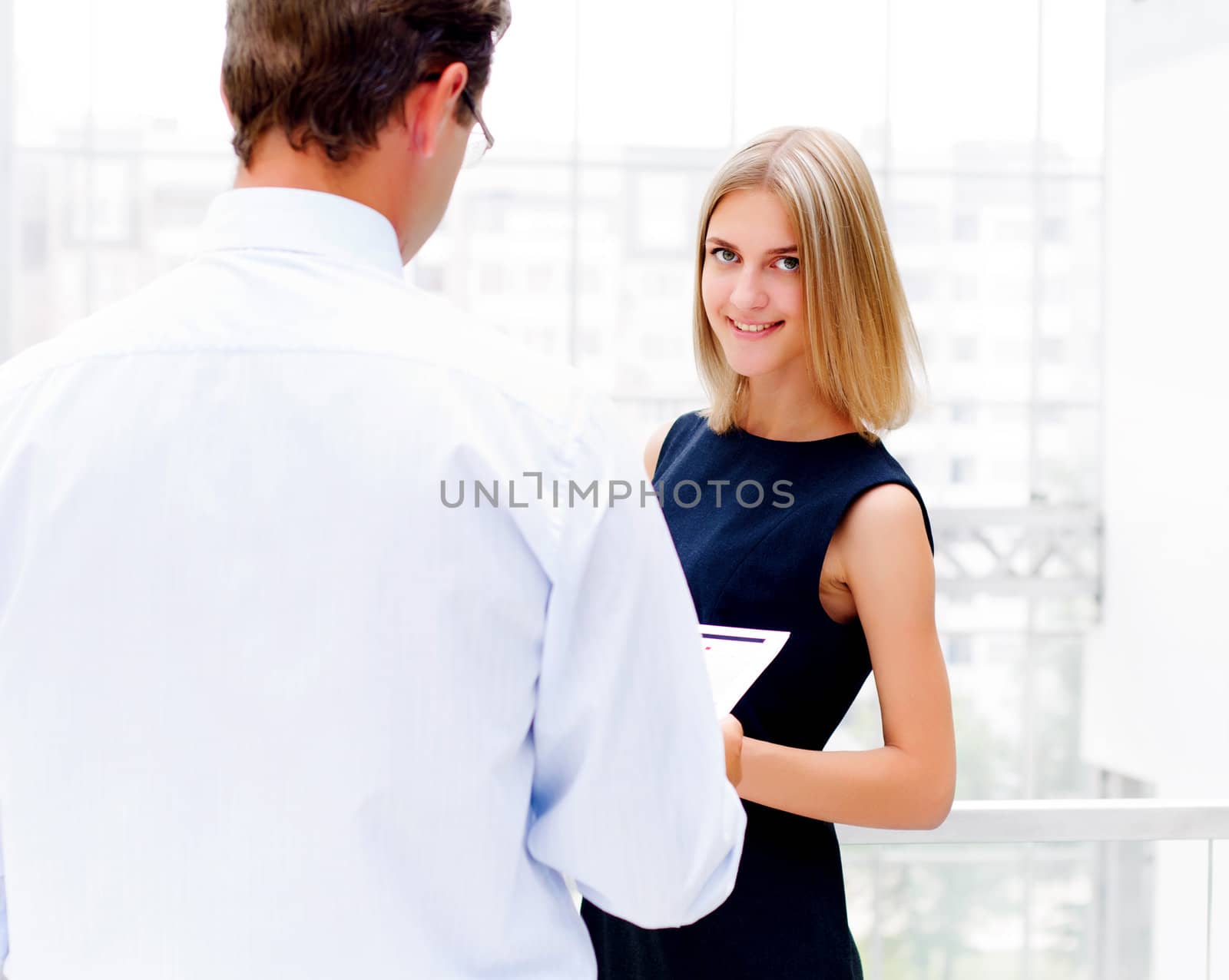 business man and business woman in the office to discuss reports by adam121