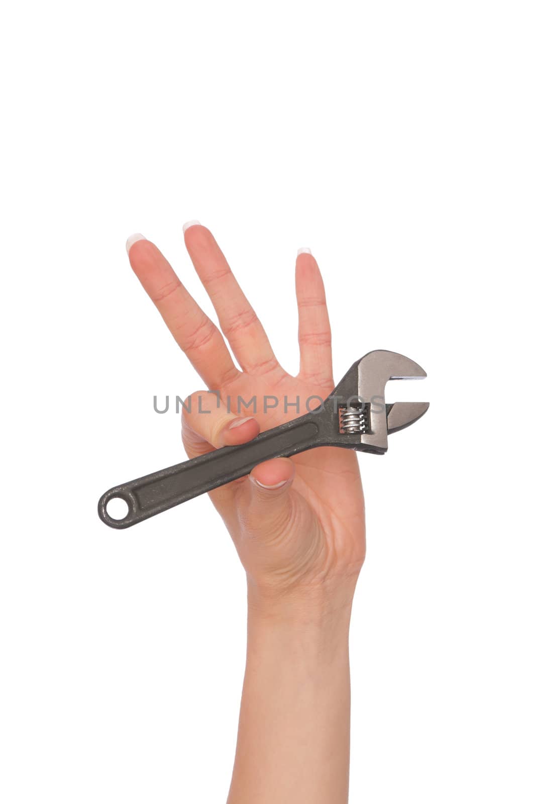 woman holding adjustable spanner in the hand