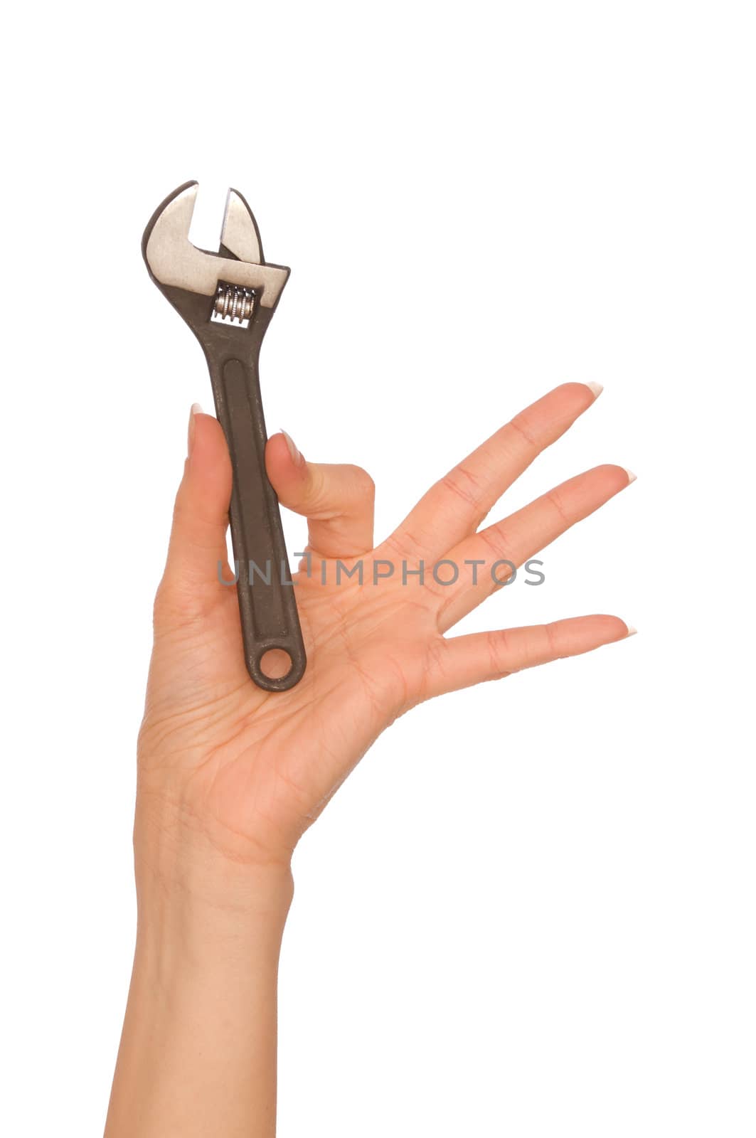 woman holding adjustable spanner in the hand