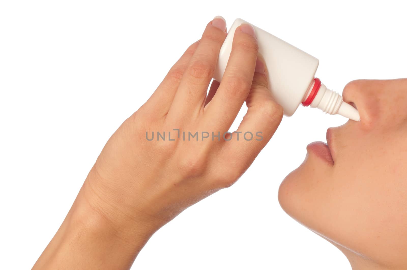 The woman drips drops for a nose for fast recover