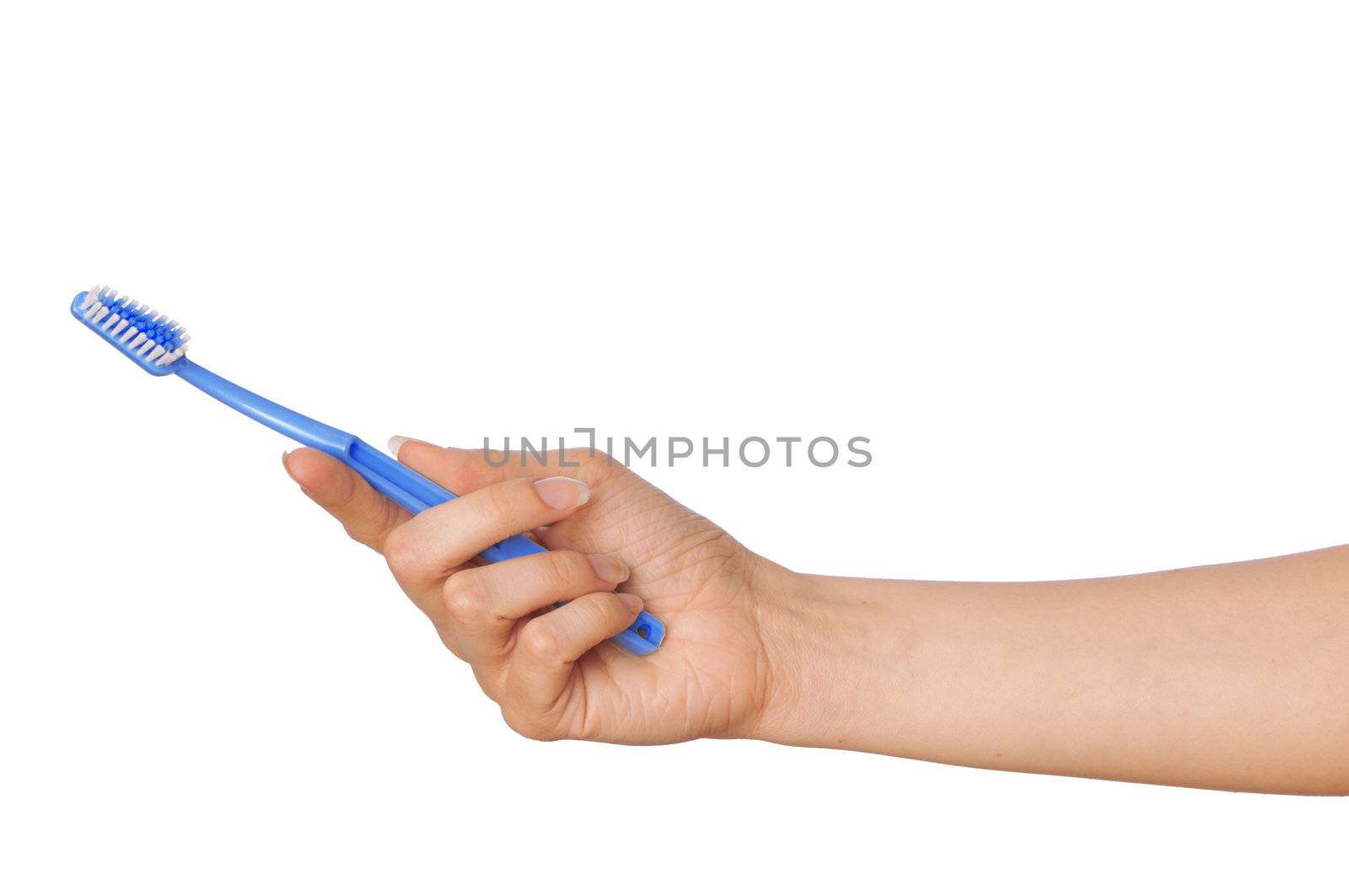 brush for toothpaste at in the girl's hand