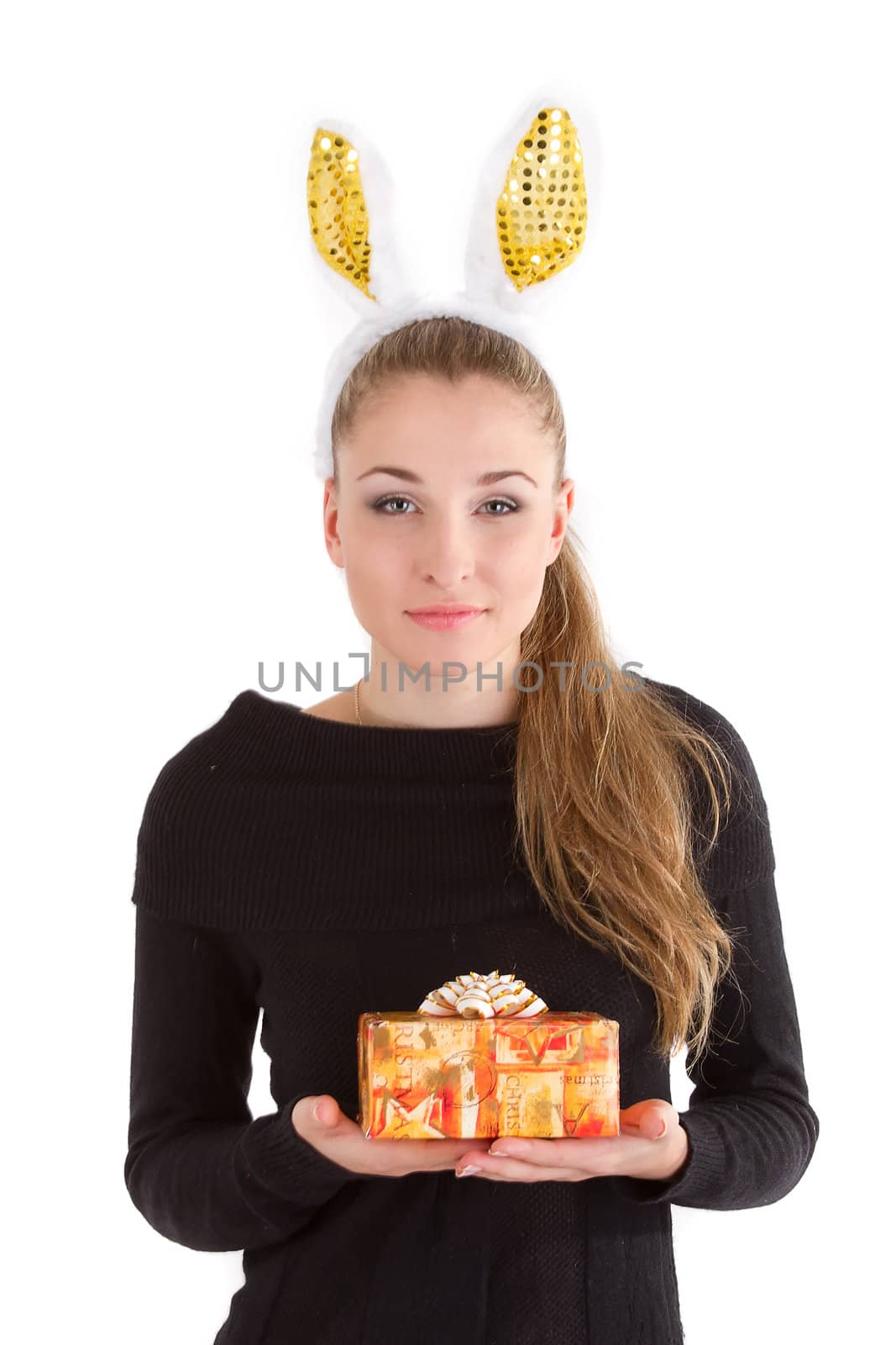Portrait of a beautiful girl with rabbit ears with a gift in their hands