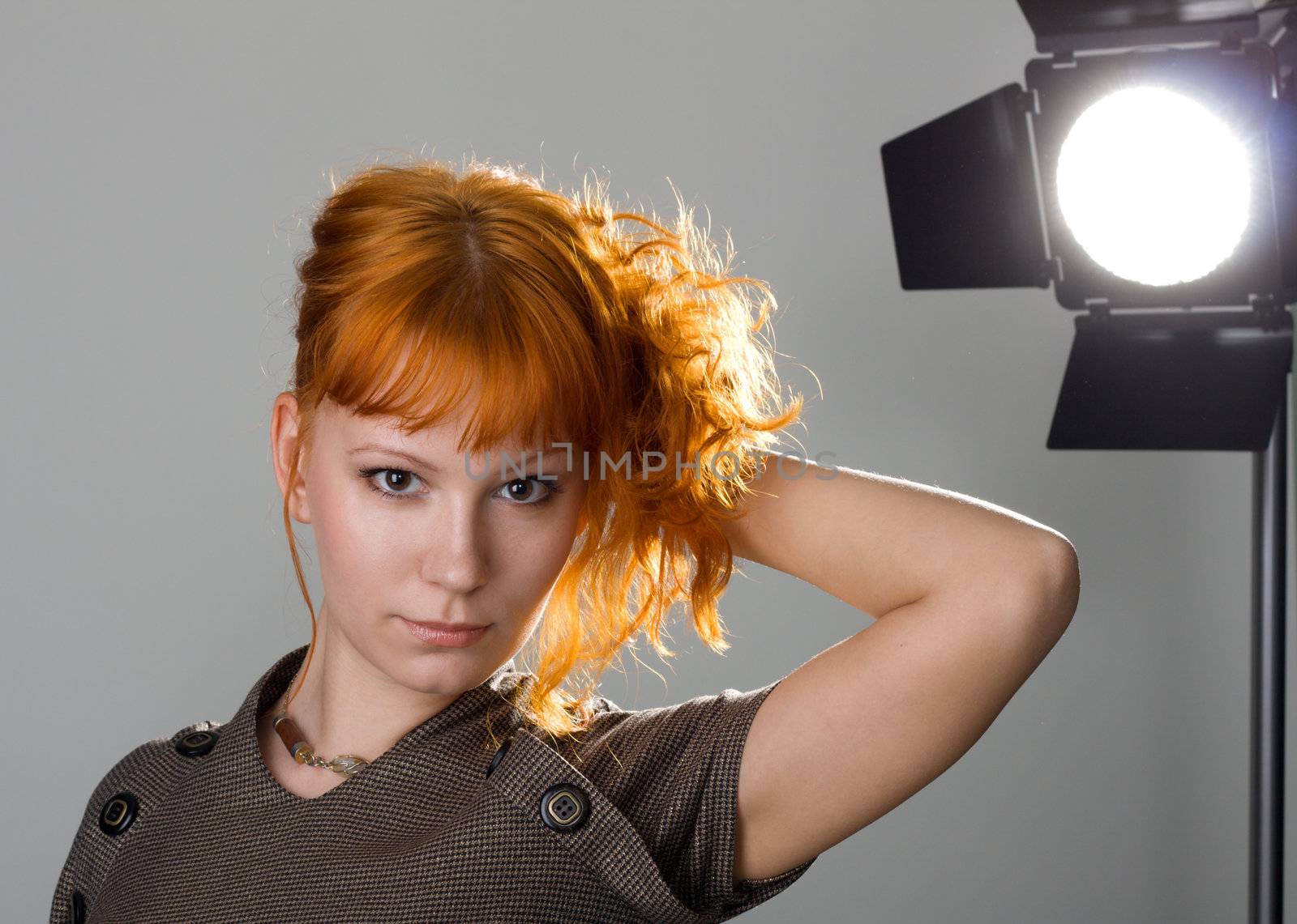 Beautiful redhead girl in studio