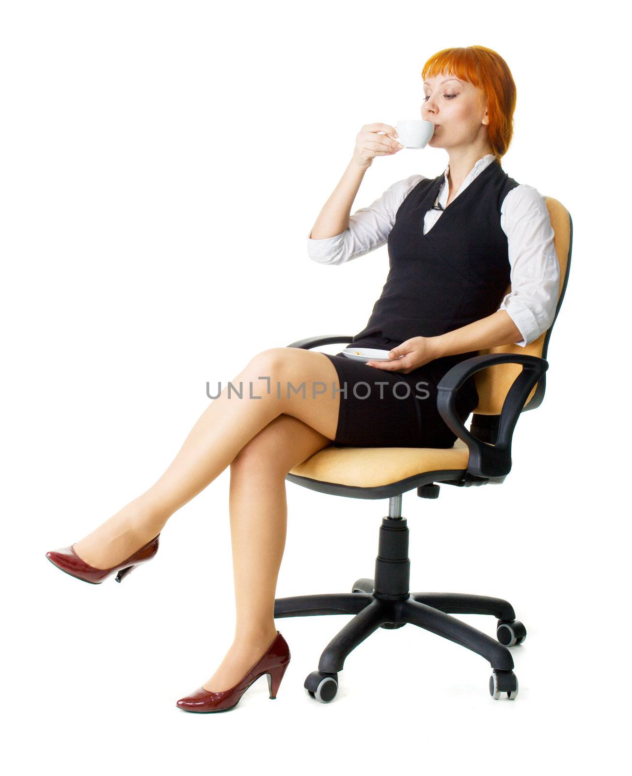 Attractive businesswoman having a coffee break