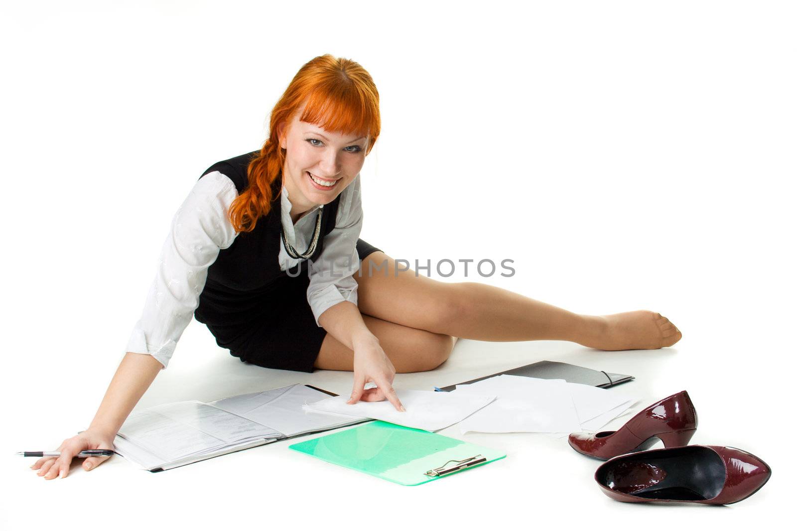 Cheerful businesswoman working with documents by Gdolgikh