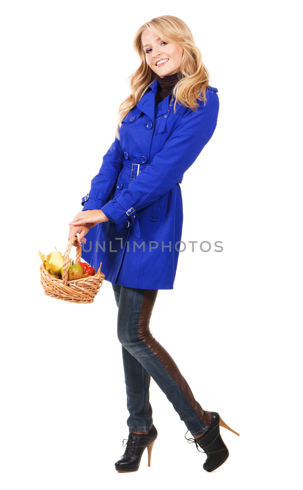 Young pretty woman with a bascket of fruit, white backgrouna