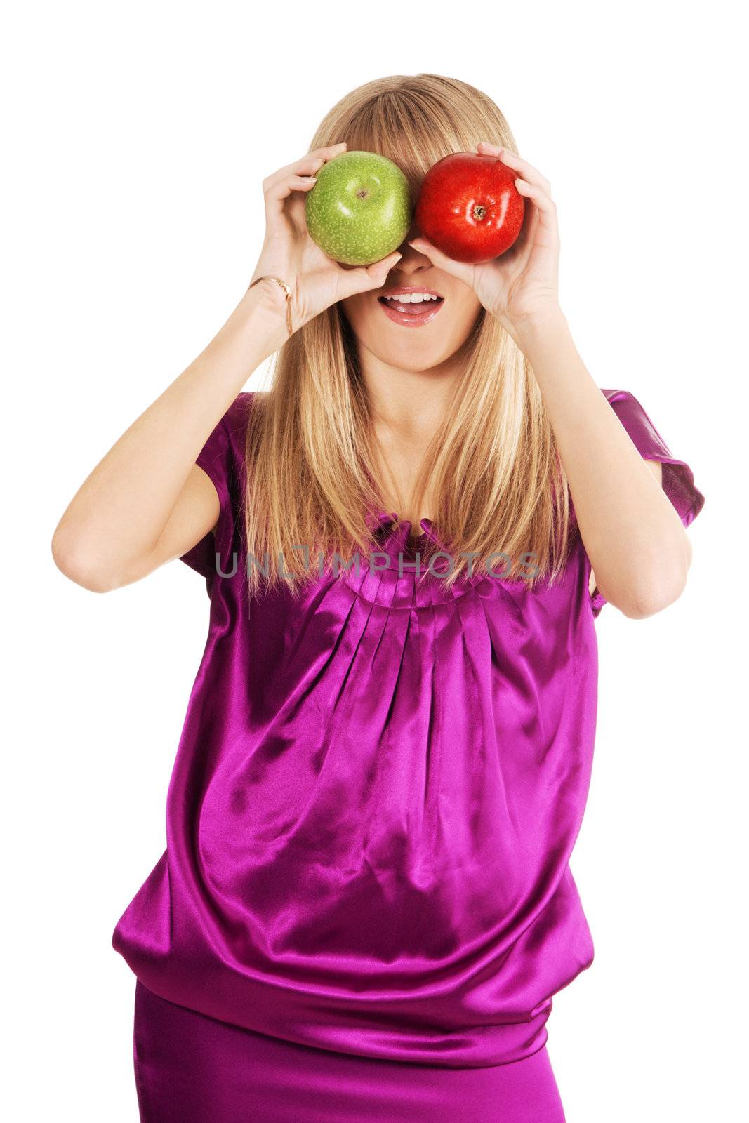 Funny woman holding two apples in front of her eyes