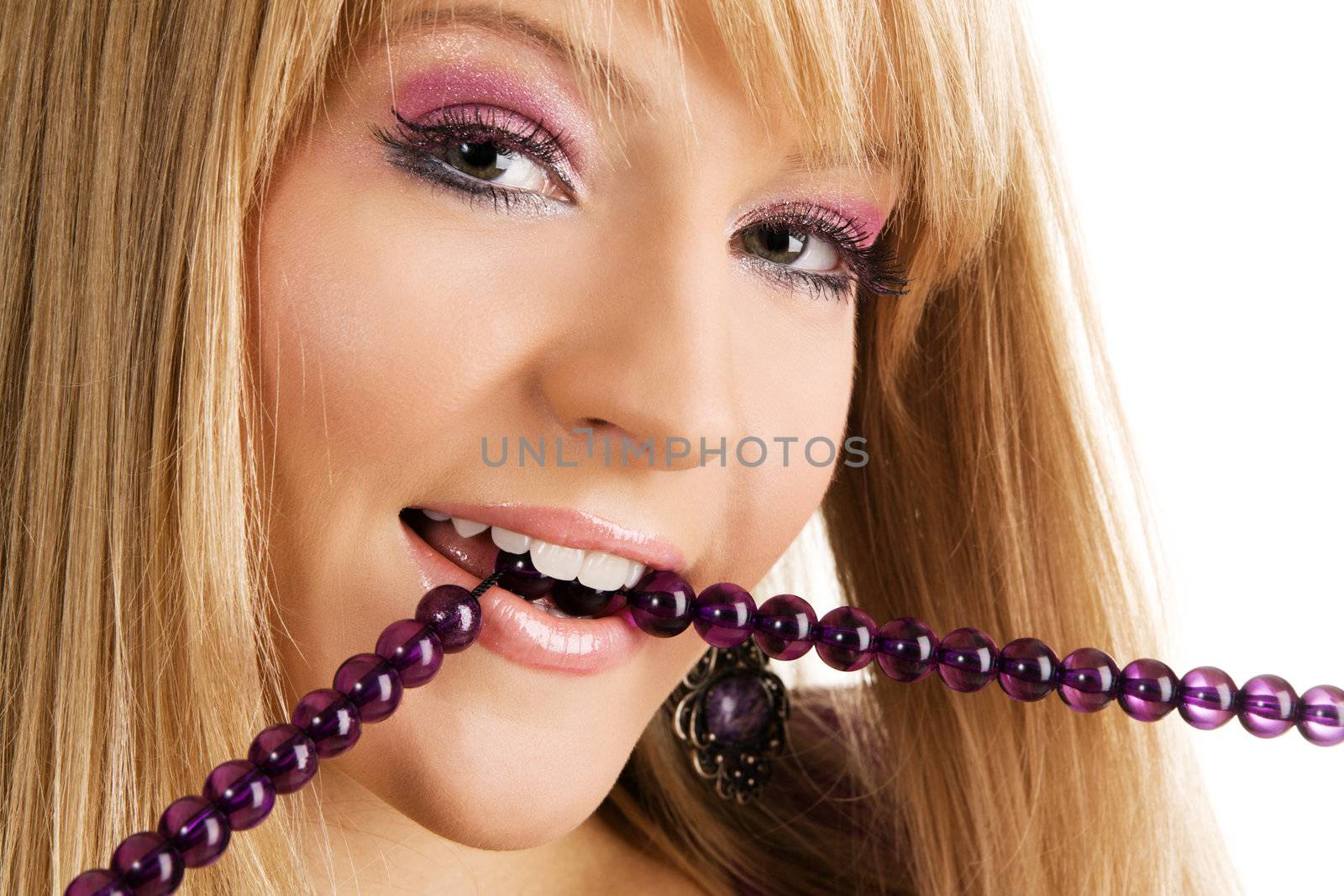 Beautiful lady in violet dress holding beads