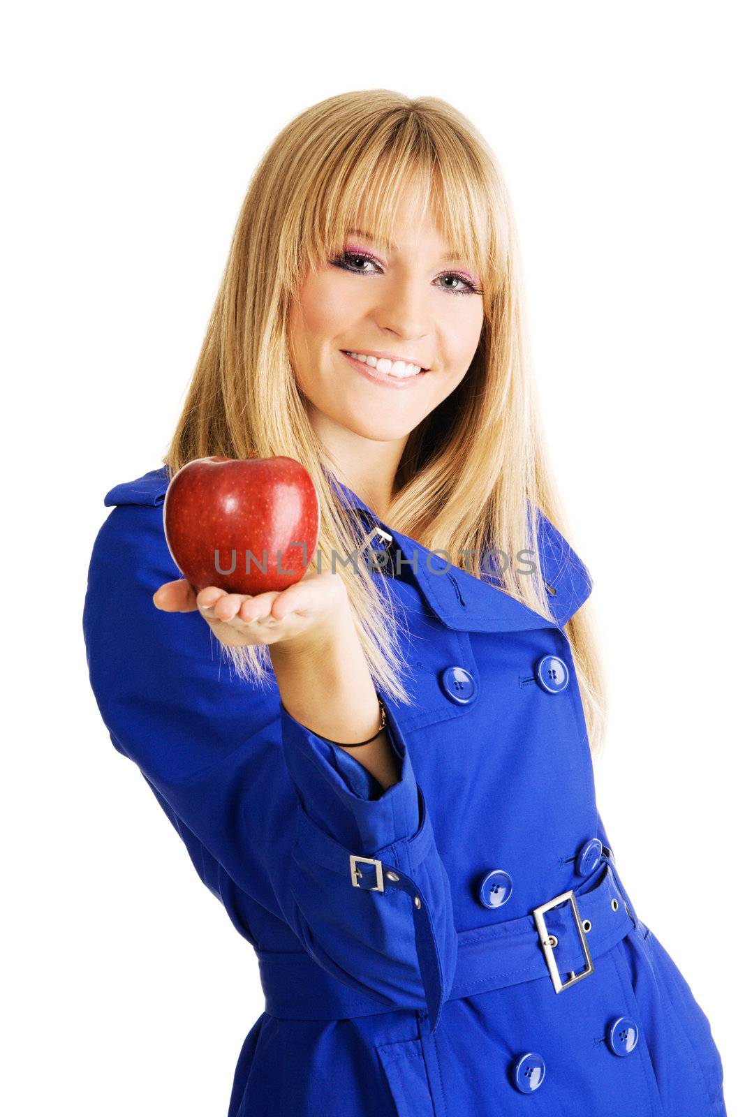 Beautiful girl holding out a fresh red apple