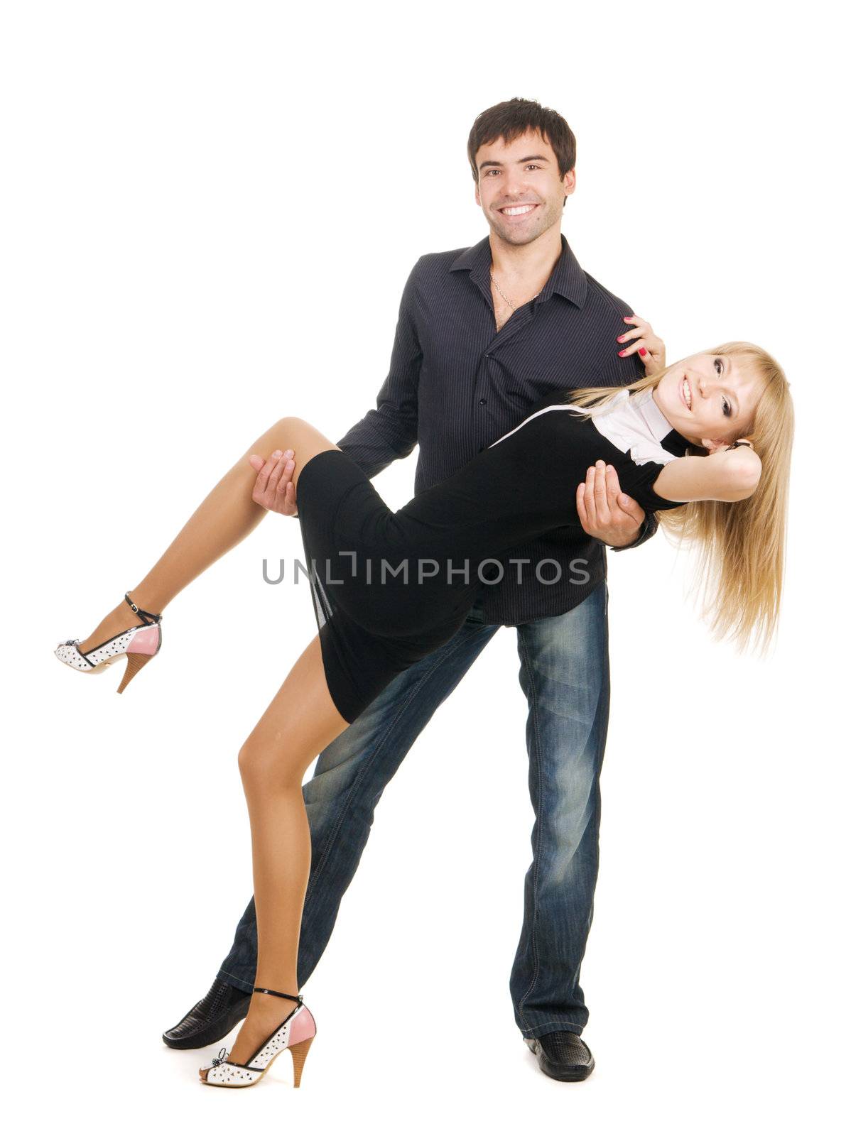 Beautiful young couple in casual clothing, white background