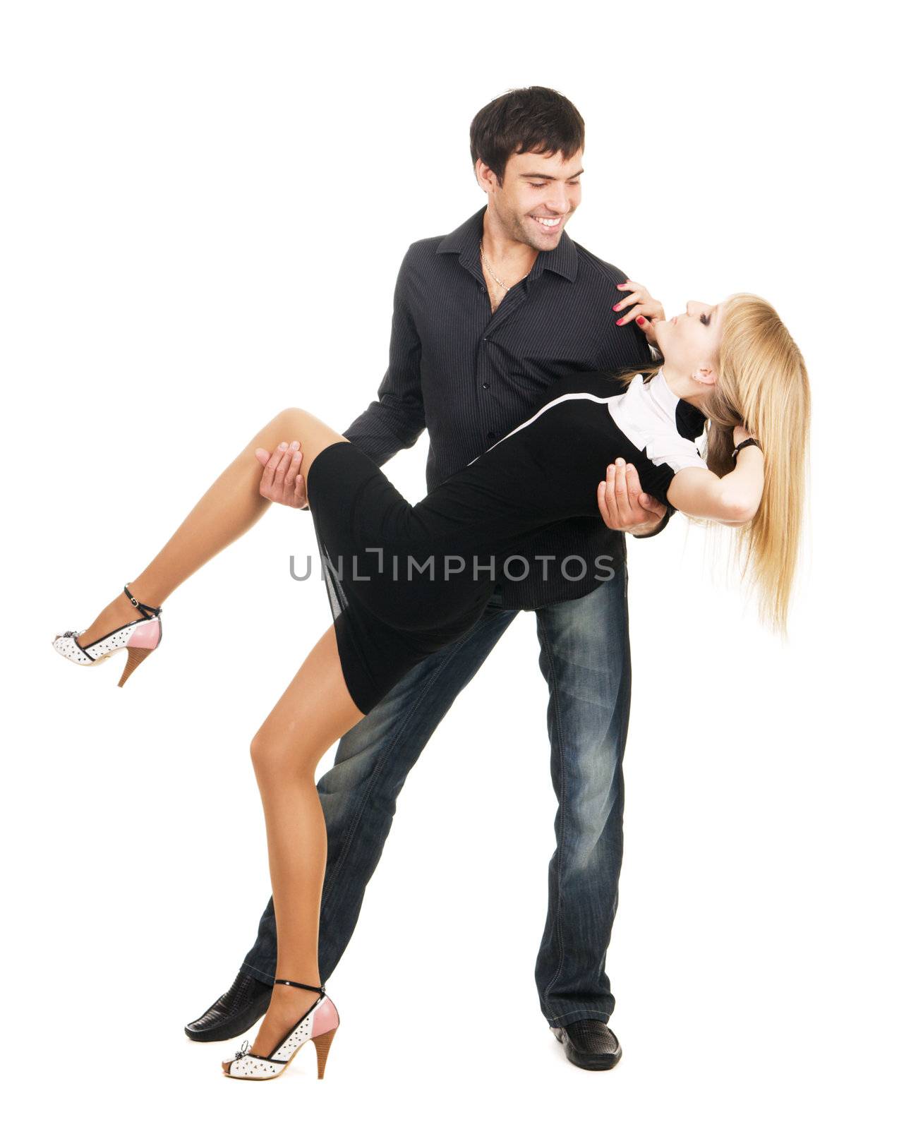 Beautiful young couple in casual clothing, white background