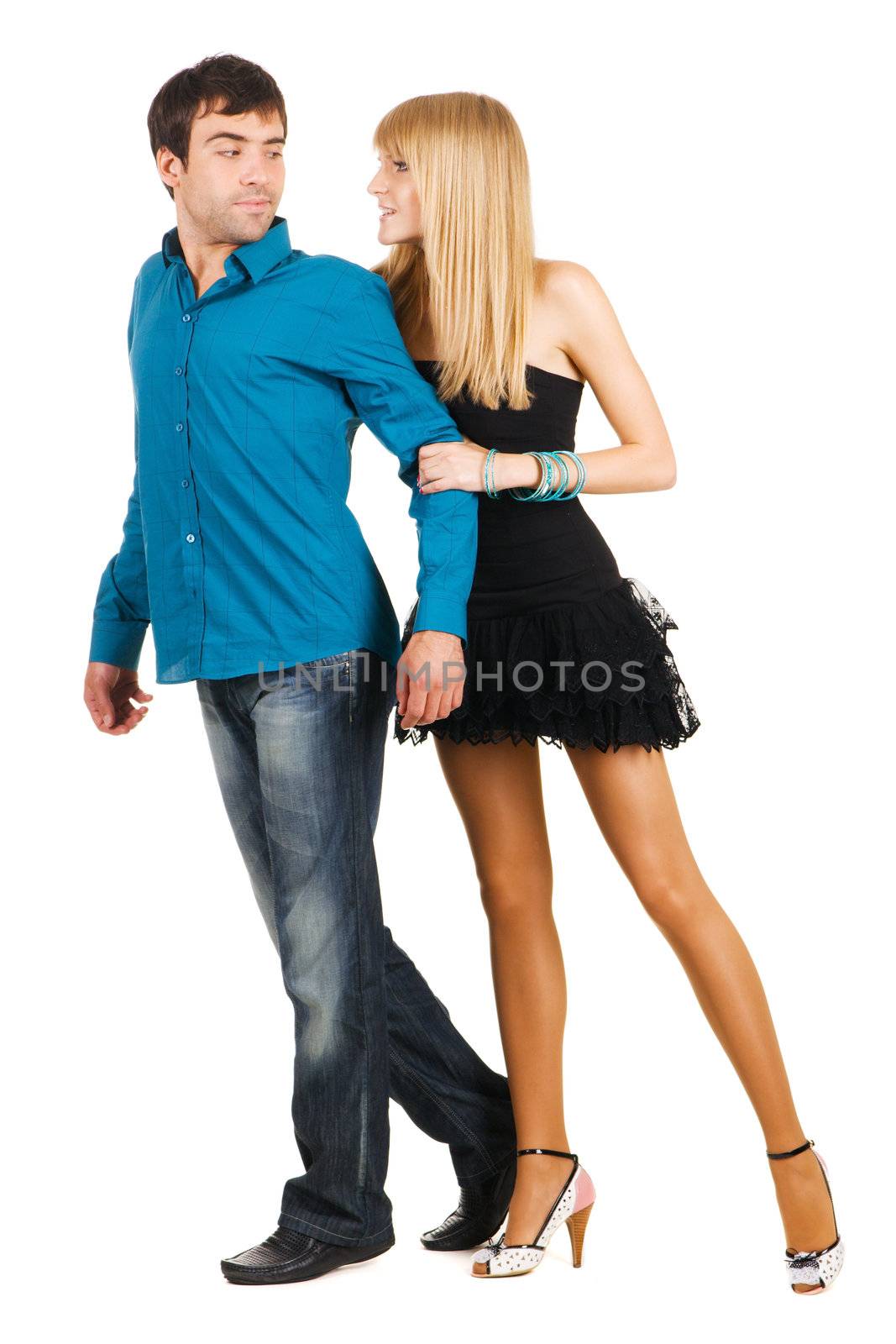 Beautiful young couple in casual clothing, white background