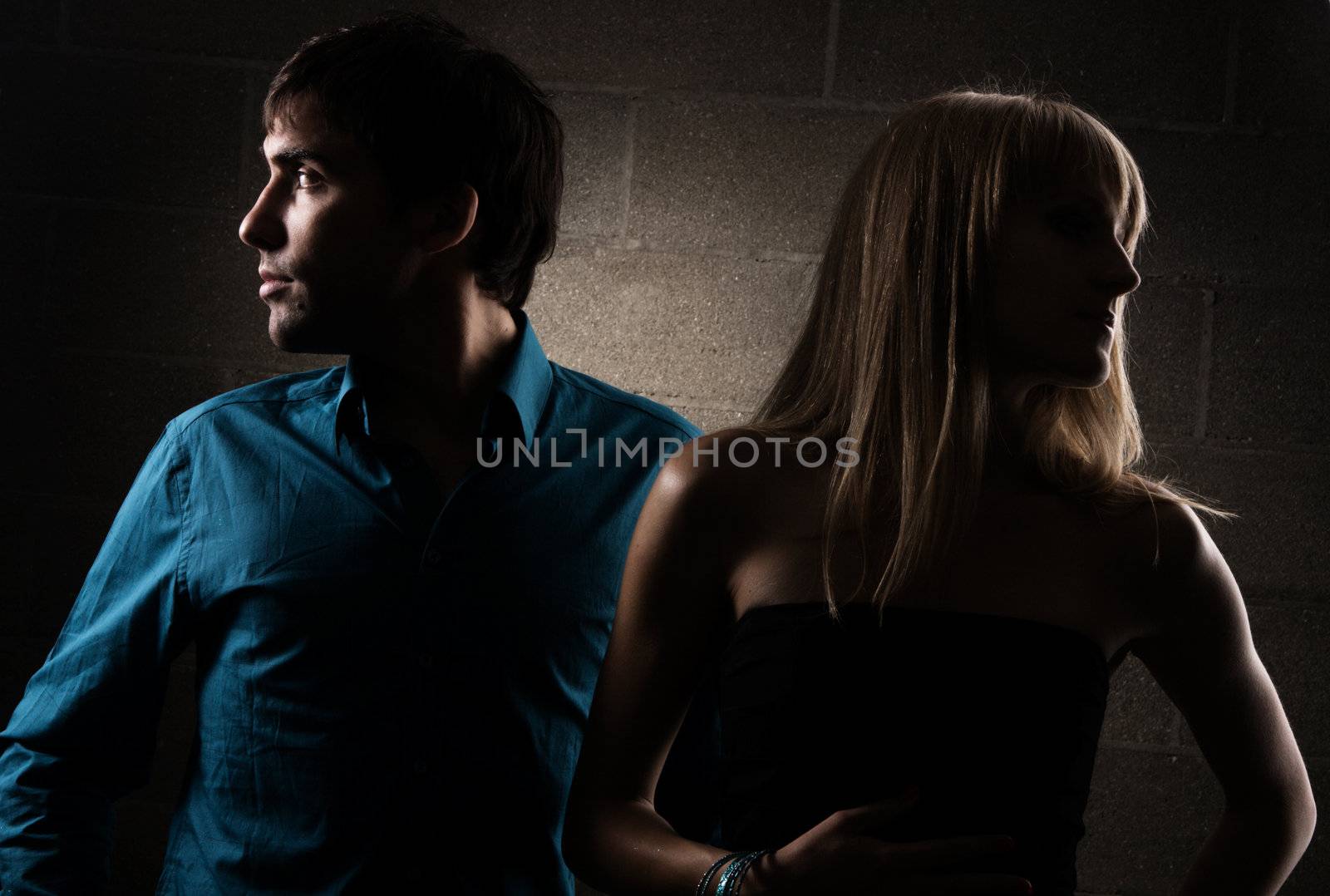 Dramatic portrait of a young elegant couple