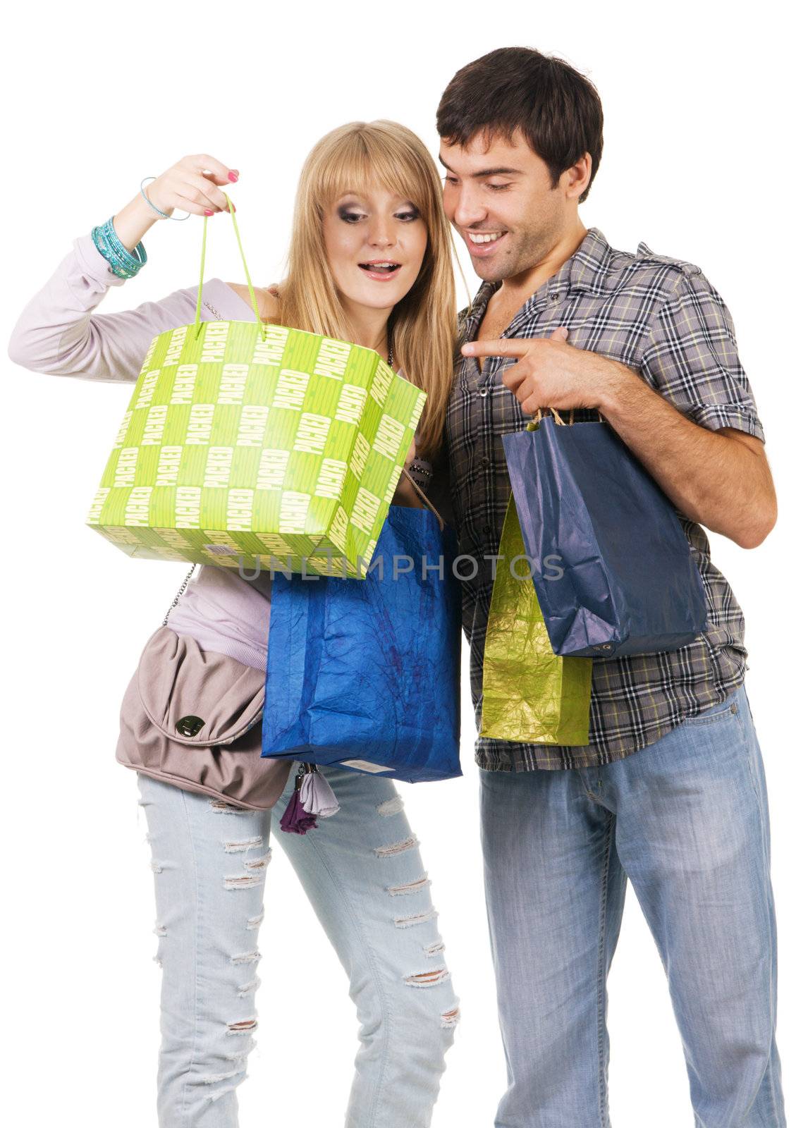 Beautiful young couple with shopping bags by Gdolgikh