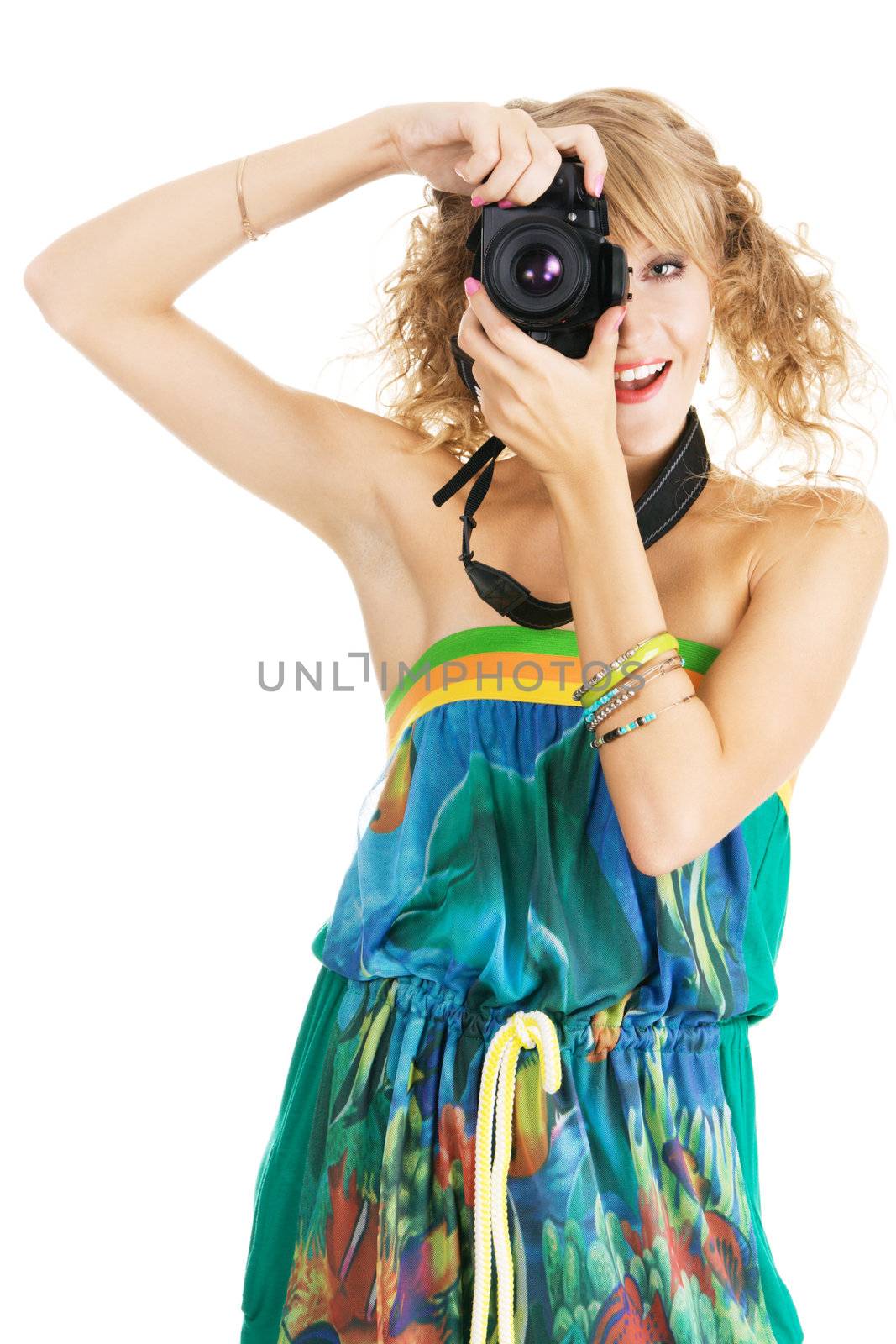 Cheerful young womanshooting with a digital photo camera