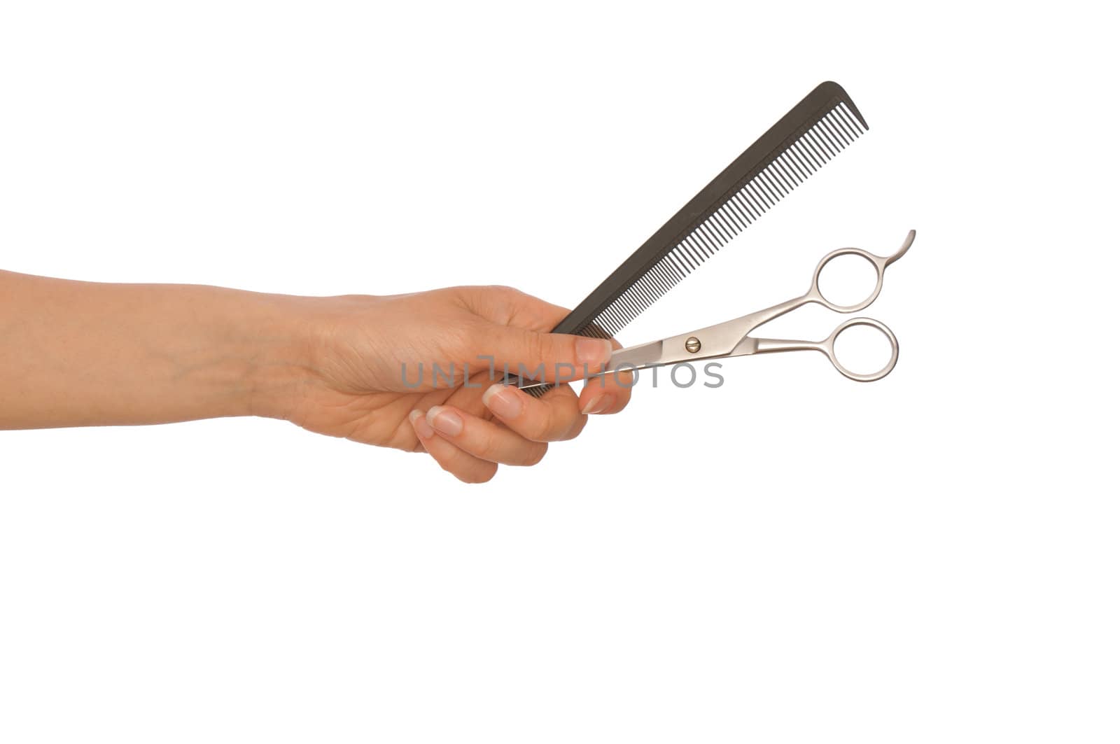 hairdresser holds scissors and hairbrush for haircut