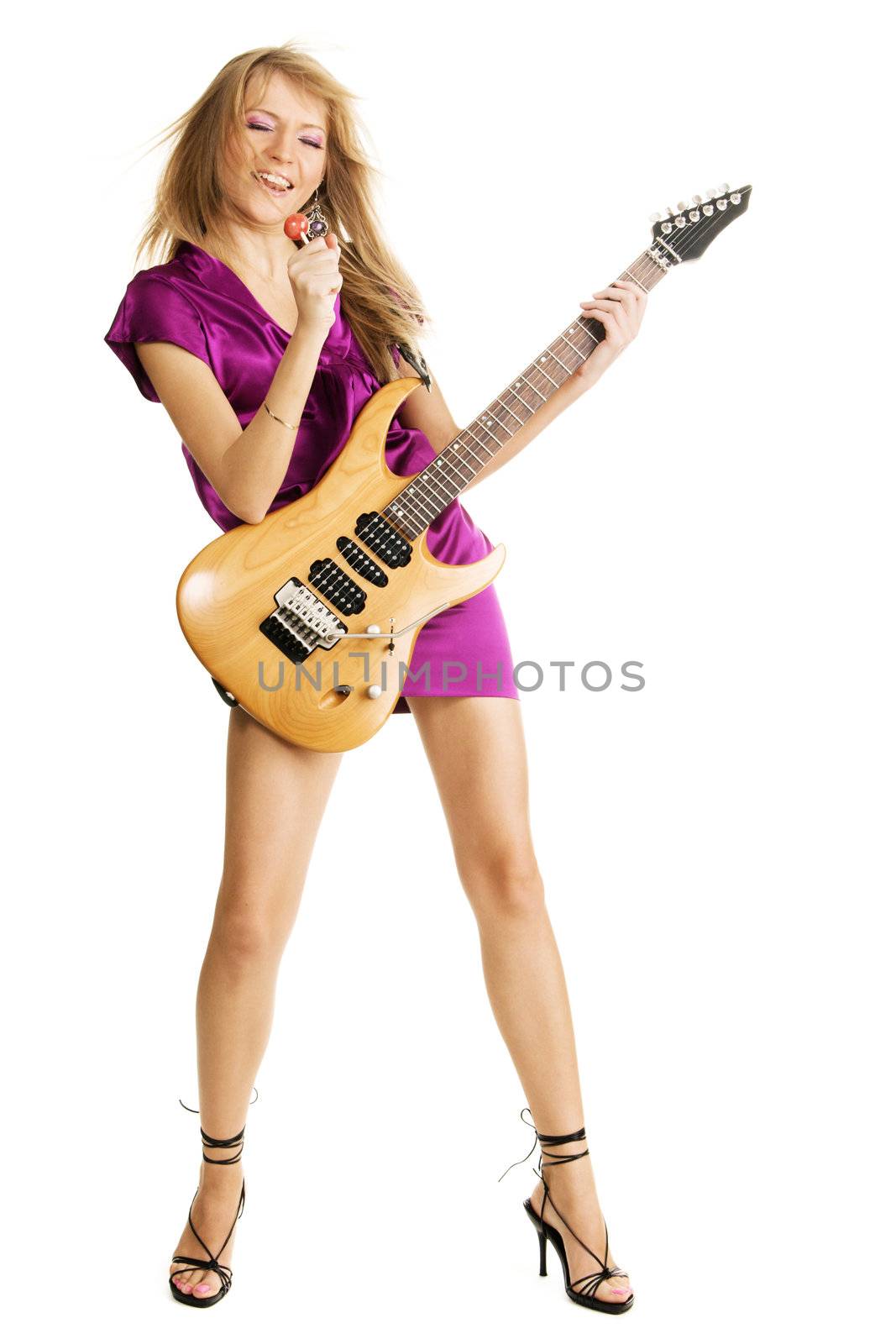 Young beautiful lady singing into a lollipop, isolated on white background