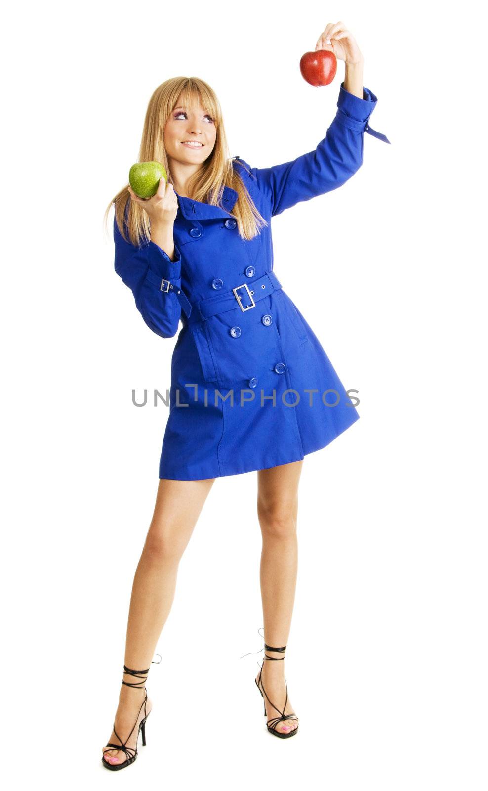 Pretty young lady comparing two fresh apples, isolated on white background