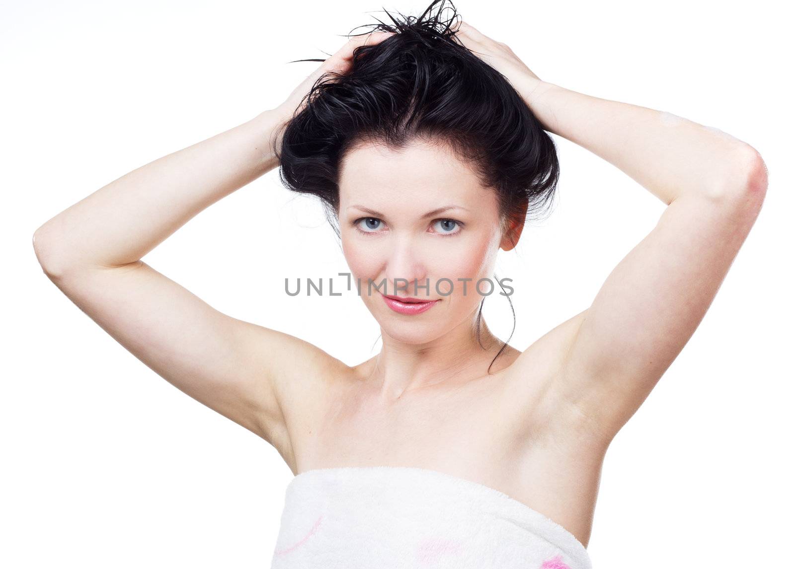 Woman in a towel after shower, white background