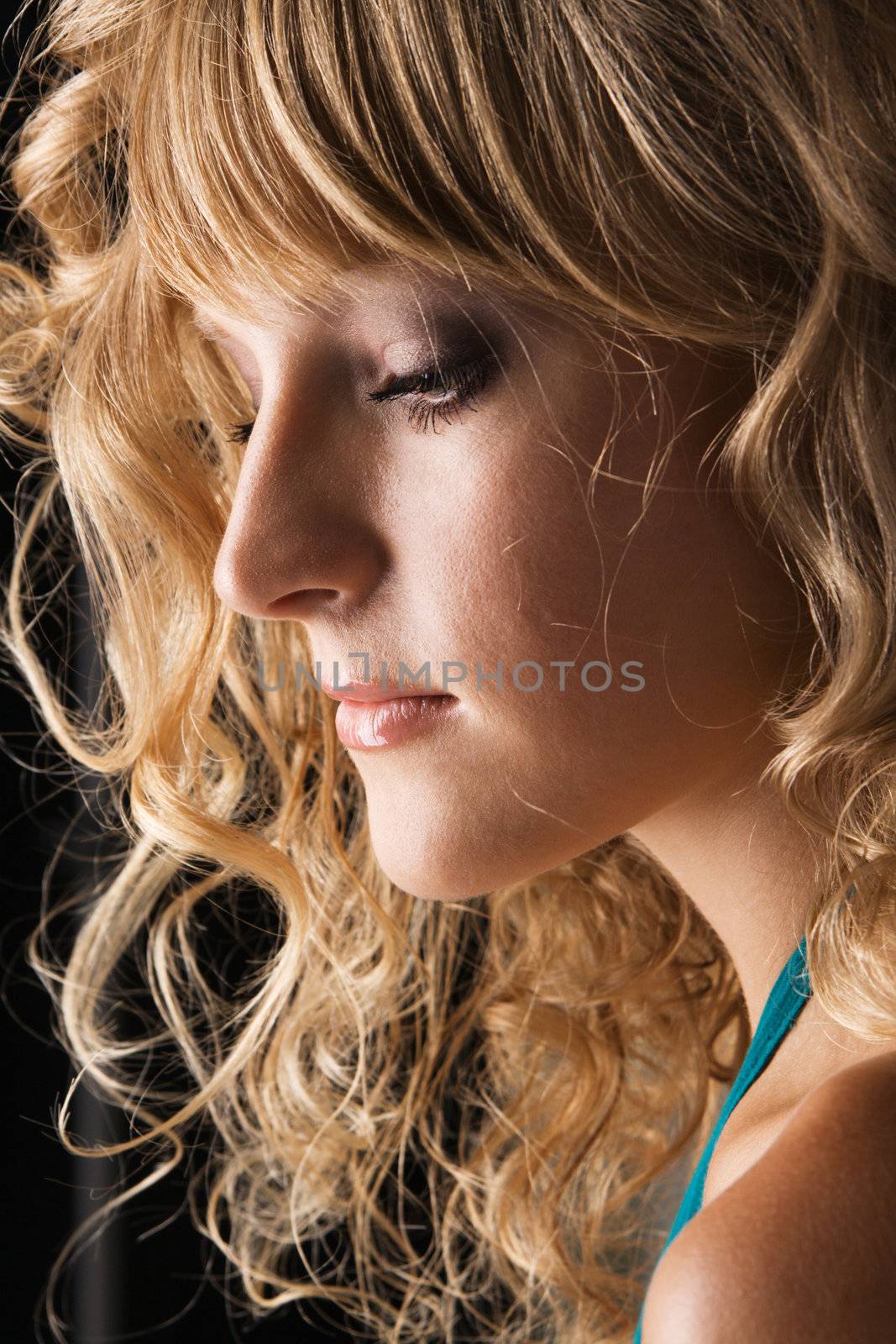 Portrait of a pretty elegant blonde with beautiful hair