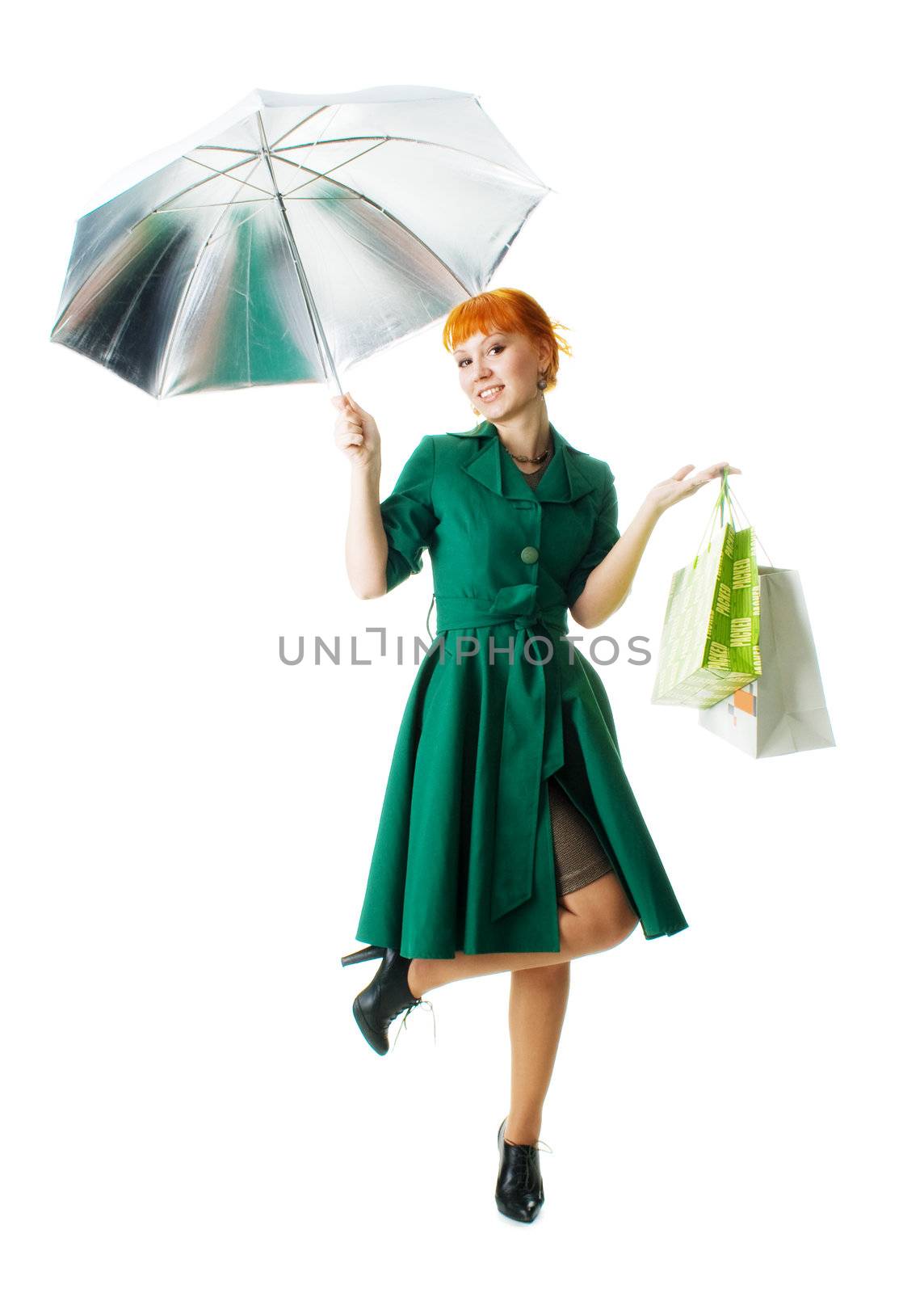 Beautiful lady with an umbrella and shopping bags