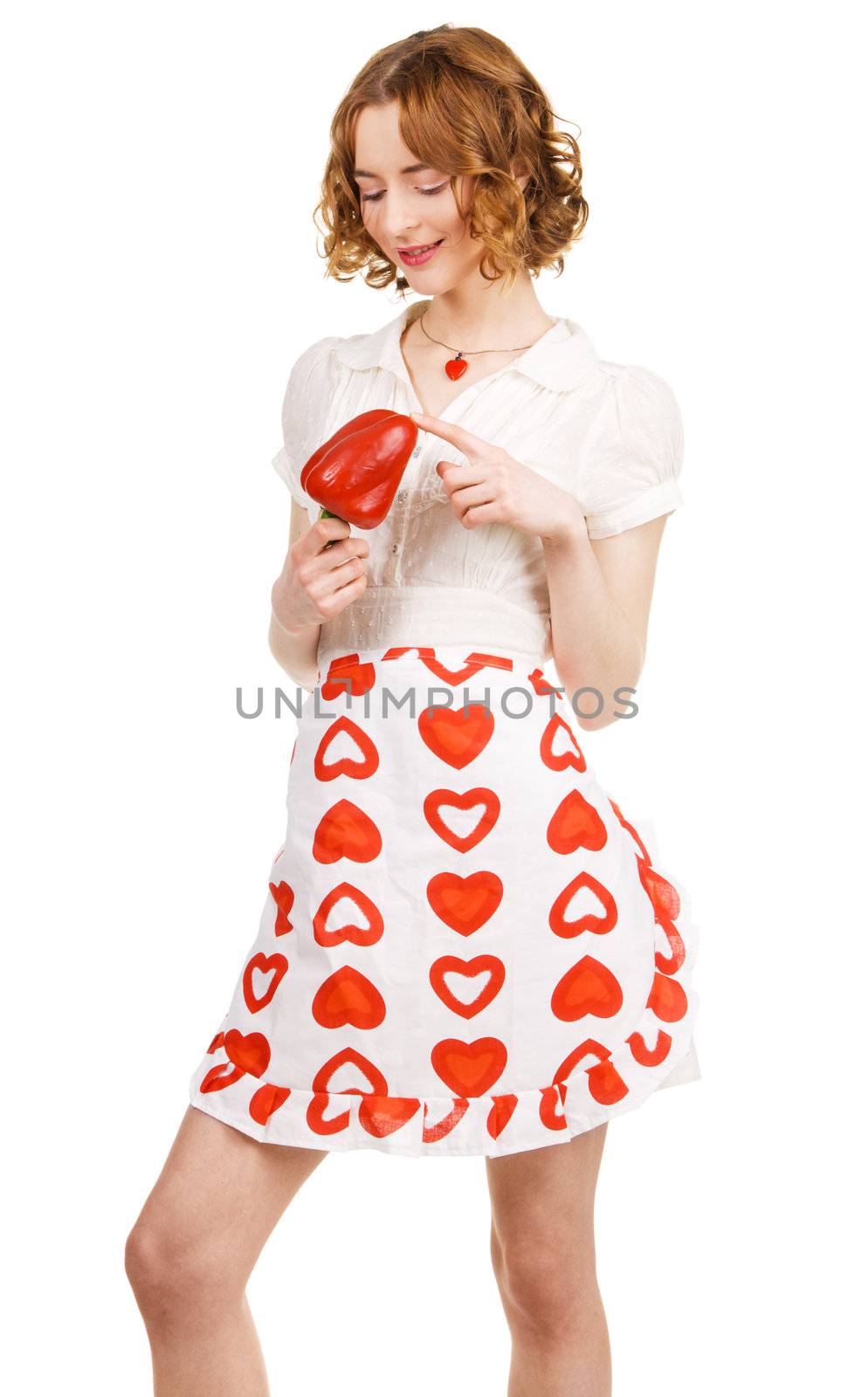 Young beautiful woman holding a paprika, white background