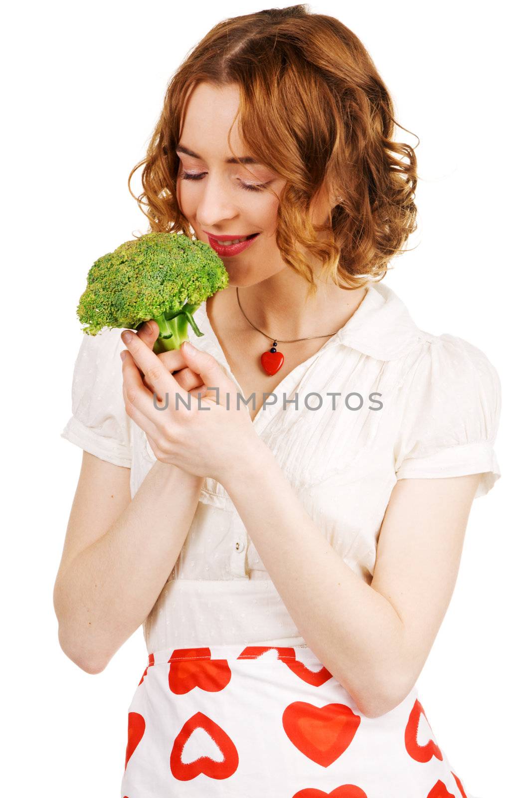 Young beautiful woman holding a broccoli, white background