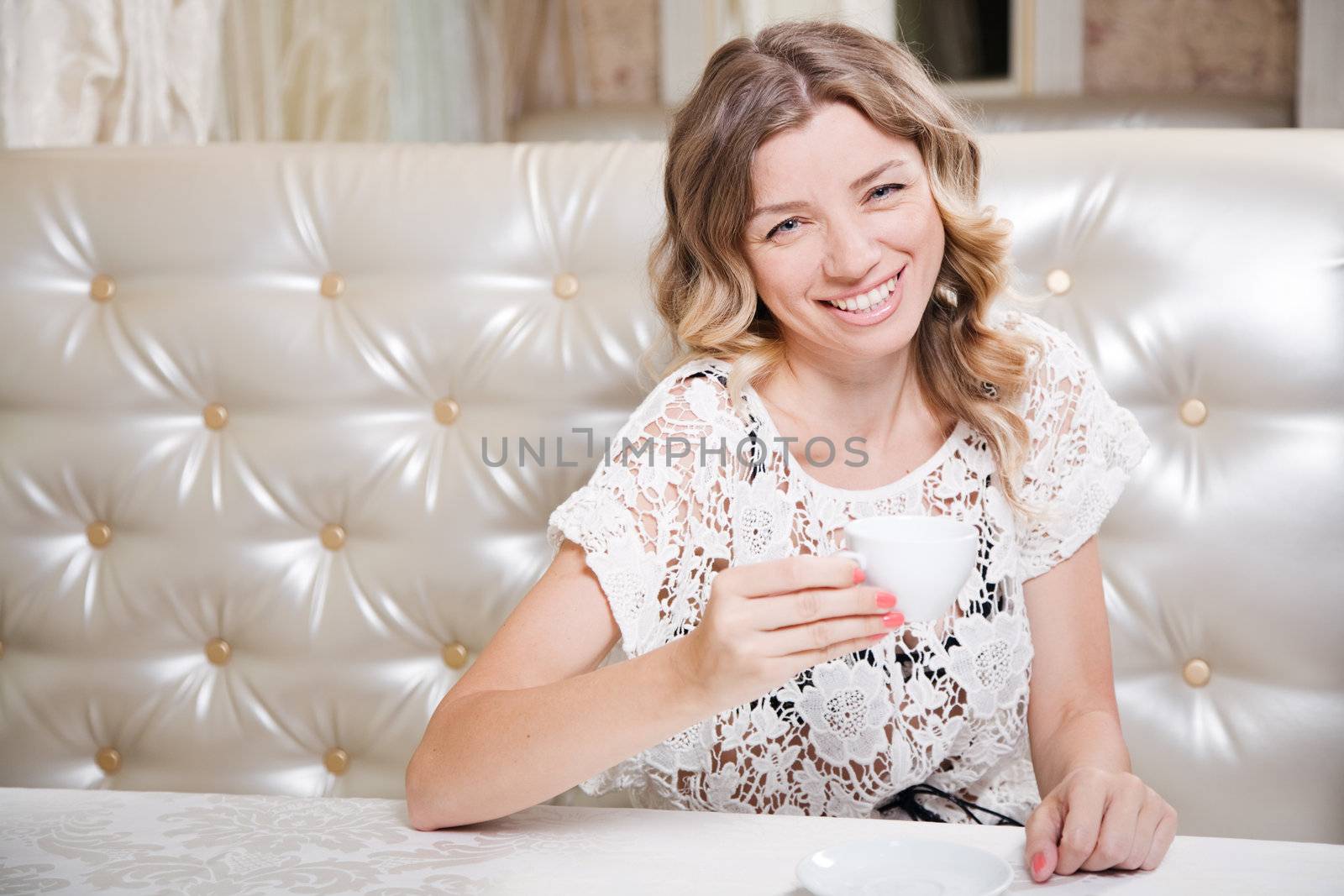 Beautiful blond lady in a restaurant