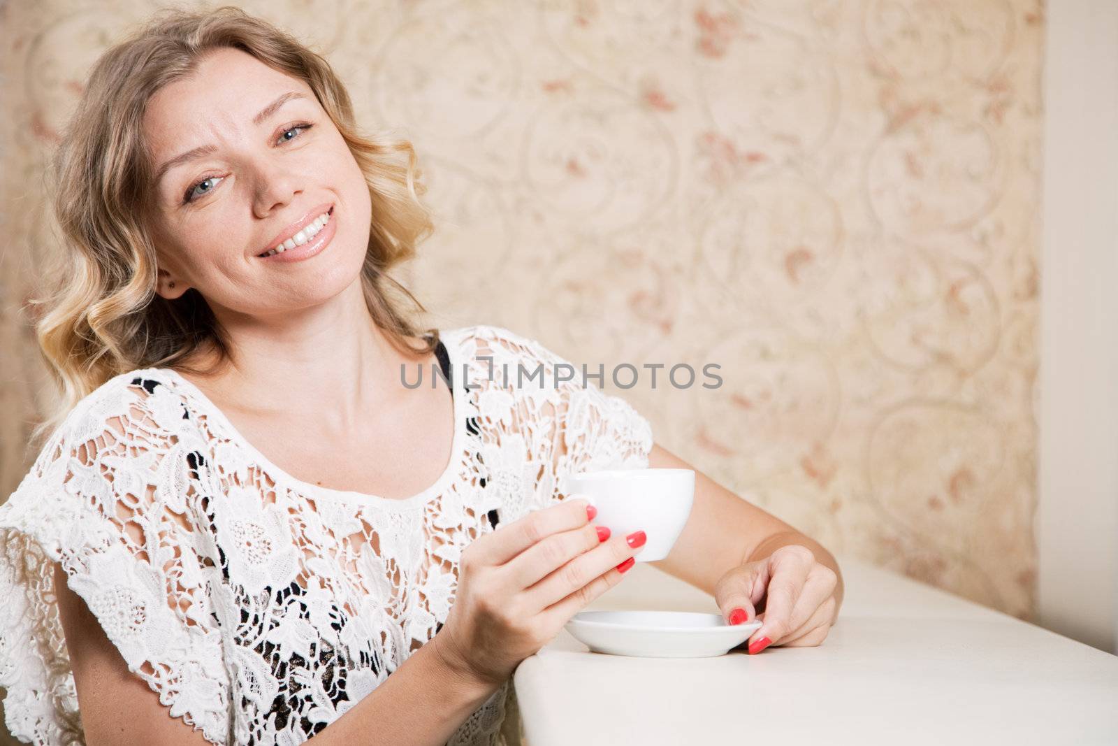 Beautiful blond lady in a restaurant