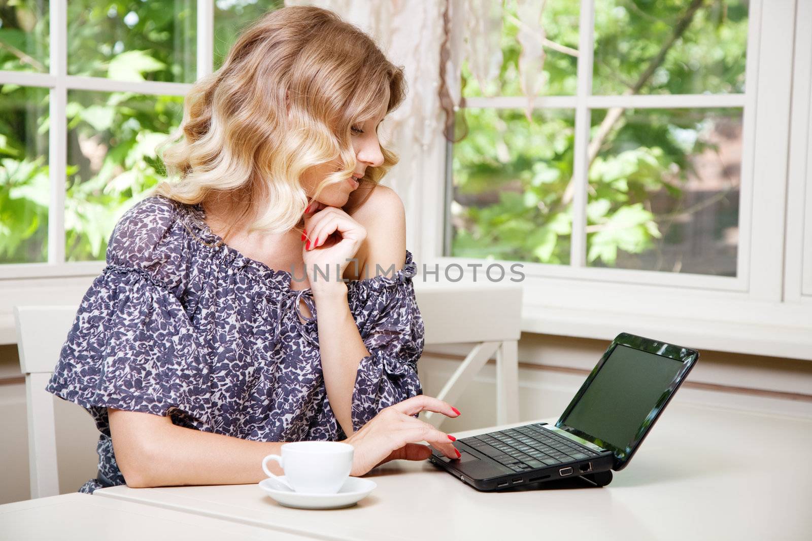 Beautiful blond lady in a restaurant