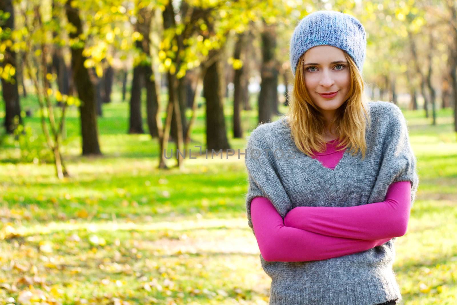Young beautiful woman in warm autumn clothing