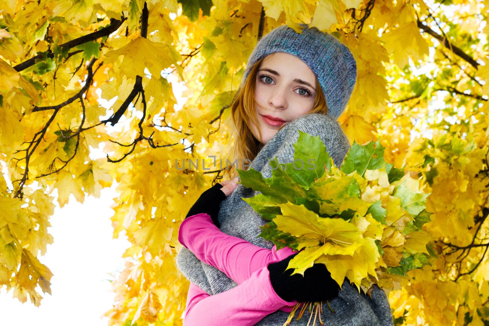 Young beautiful woman in warm autumn clothing