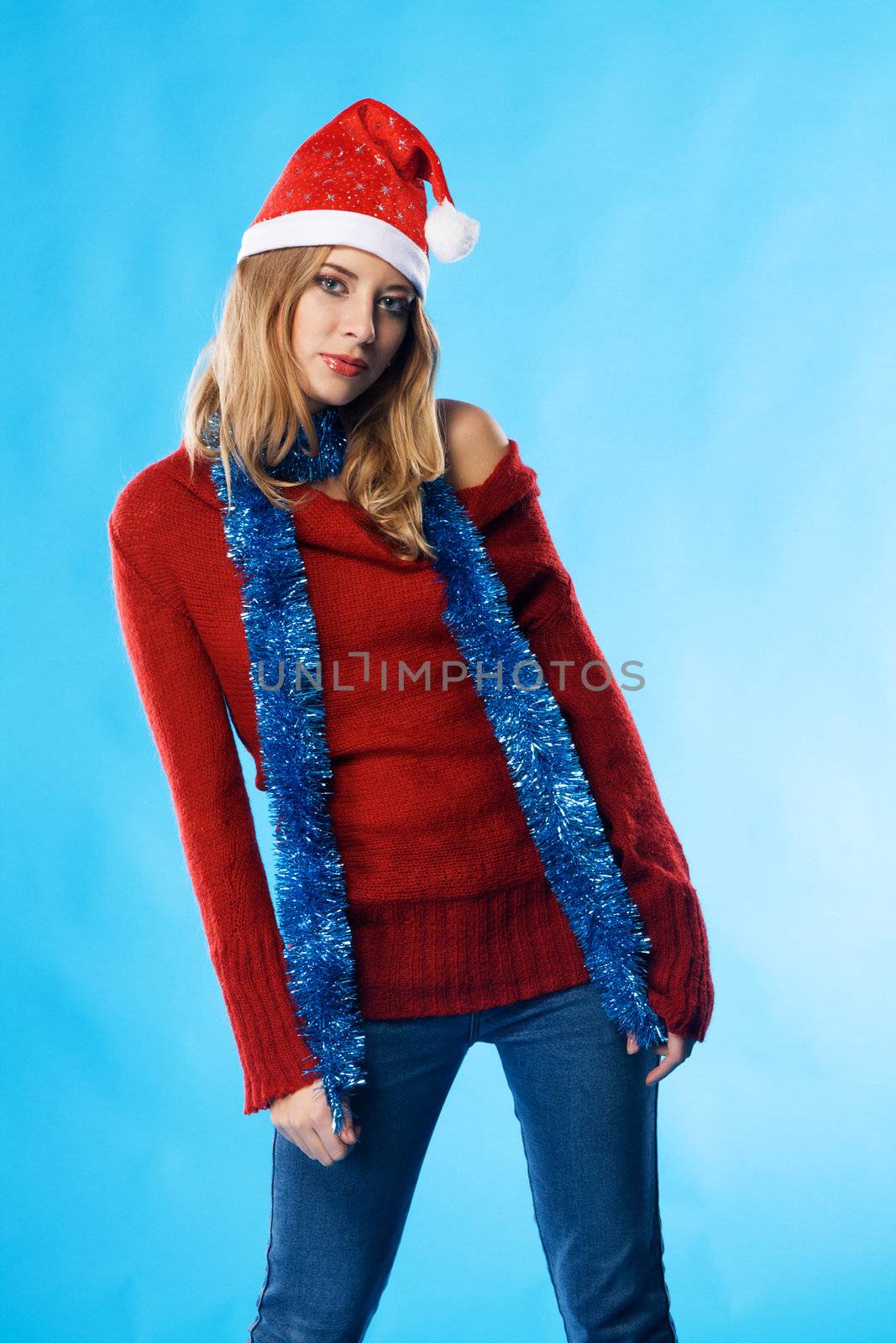 Lovely Christmas girl against blue background