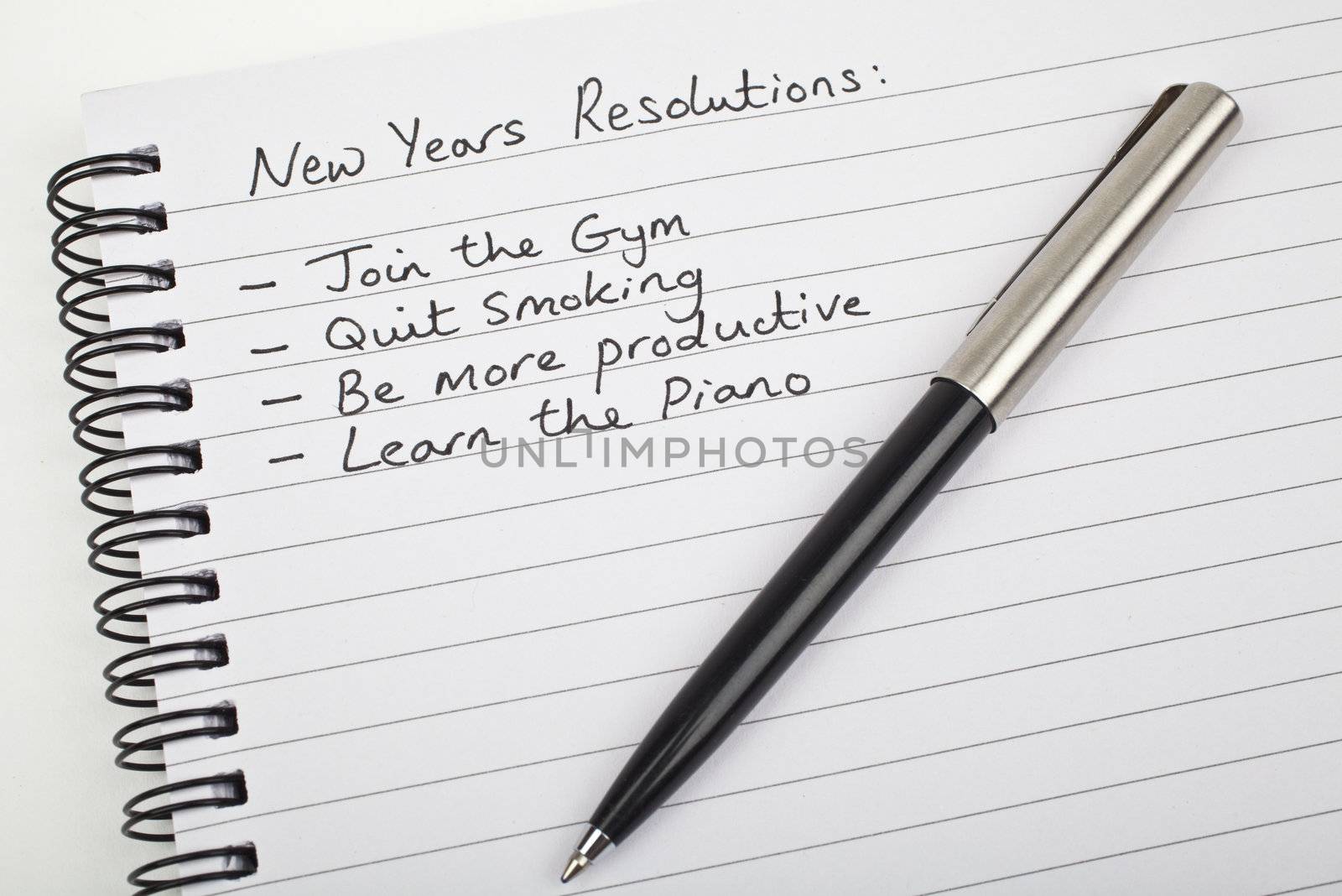 New Years Resolutions written on a note pad.