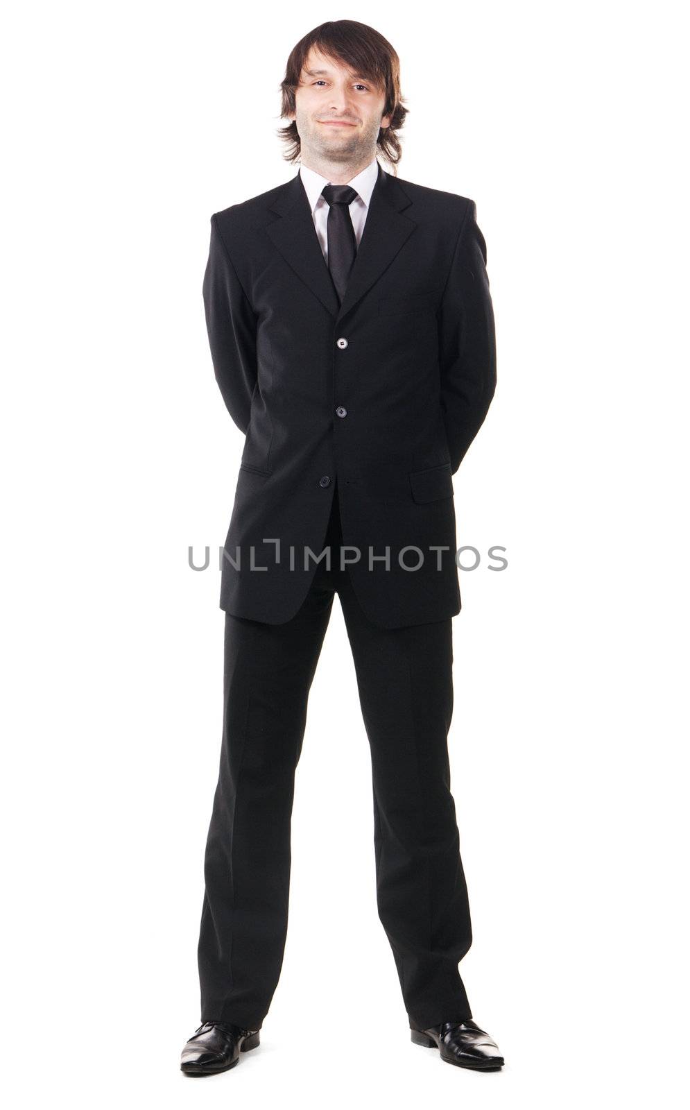 Elegant man in black suit against white background 