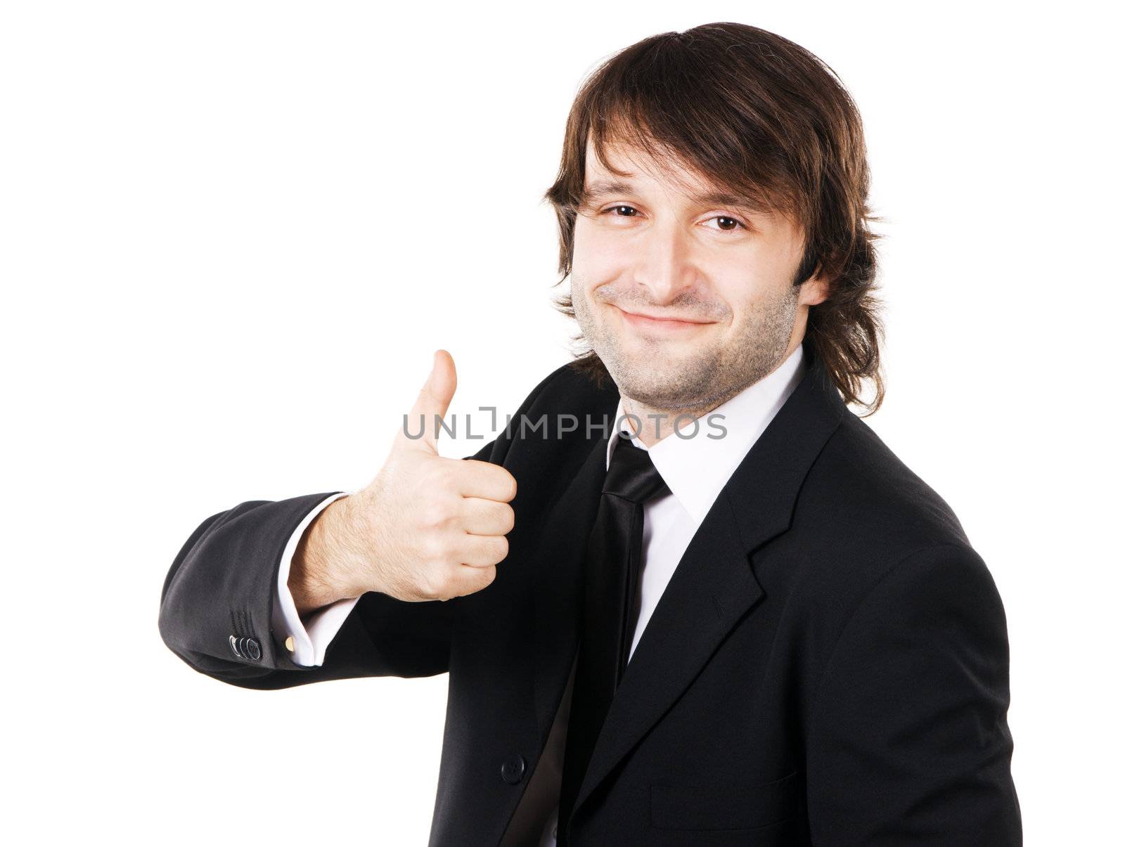 Friendly handsome businessman showing thumbs up sign 