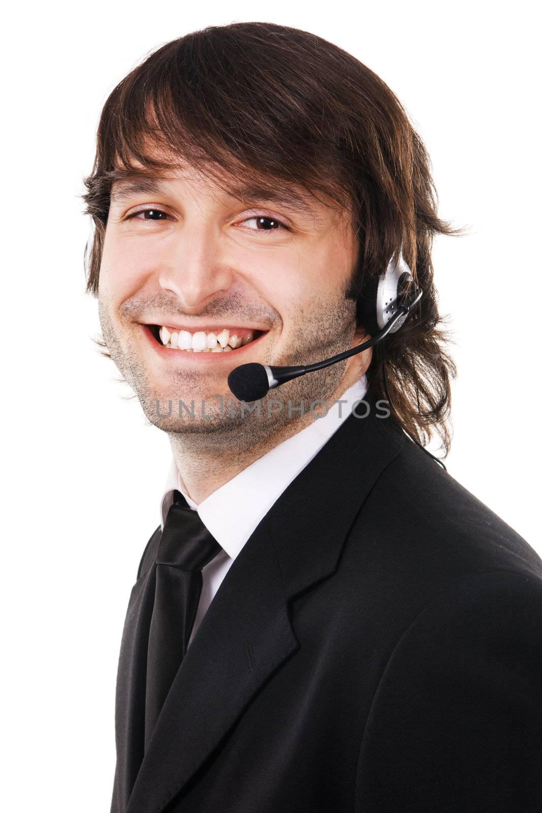 Portrait of a happy young businessman with headset isolated over white background 