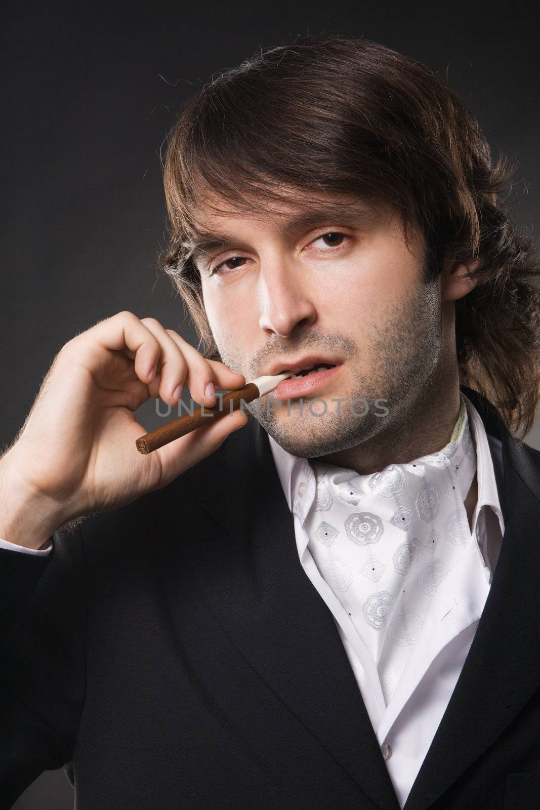 Handsome young man in business suit, studio photo