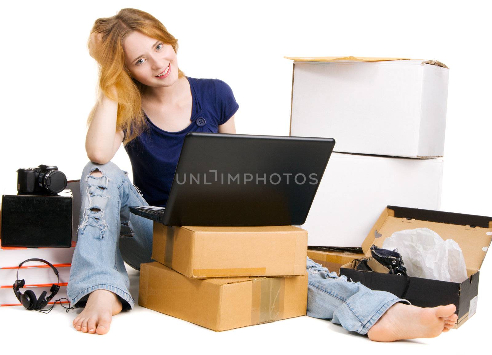 Young girl surrounded by her delivered online orders