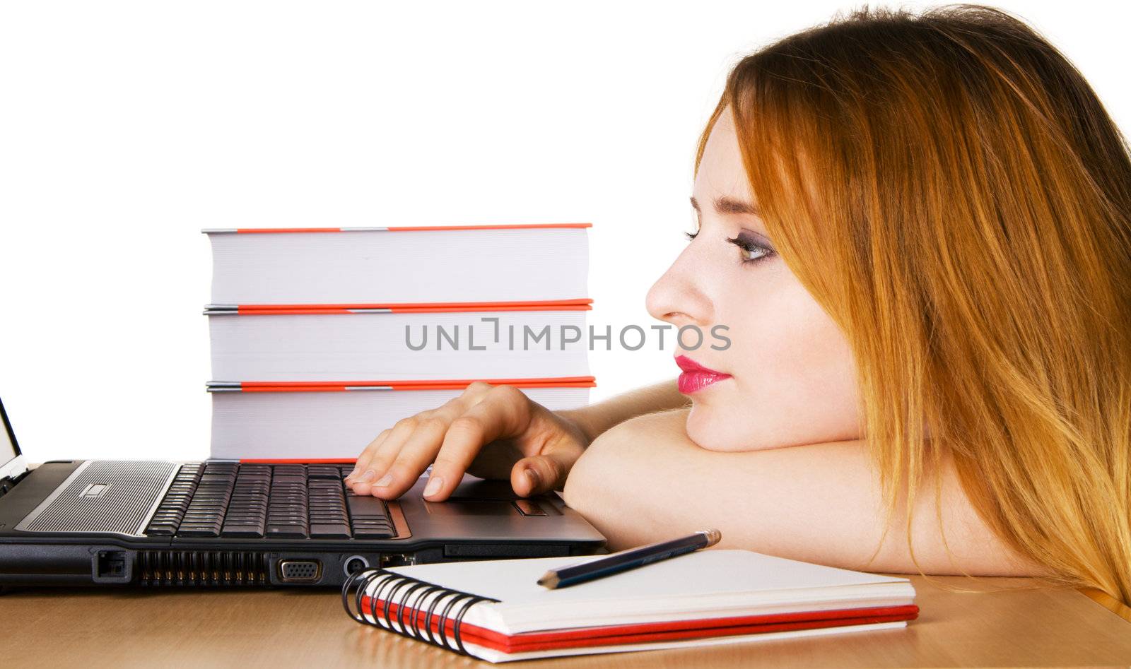Young girl surfing the internet at her laptop