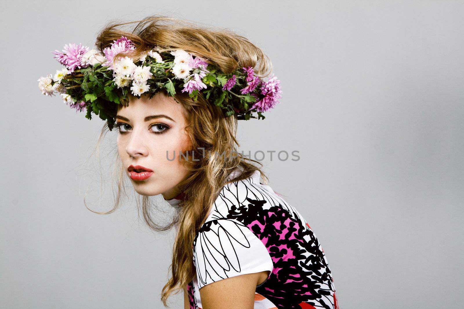 Portrait of a beautiful fashion model in flower crown