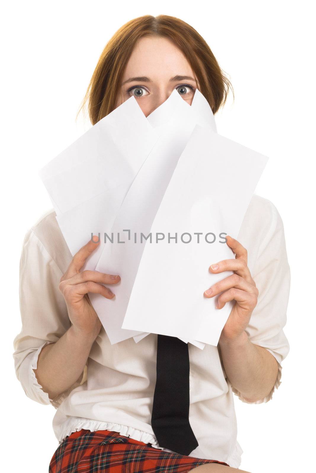Pretty girl covering her face with paper