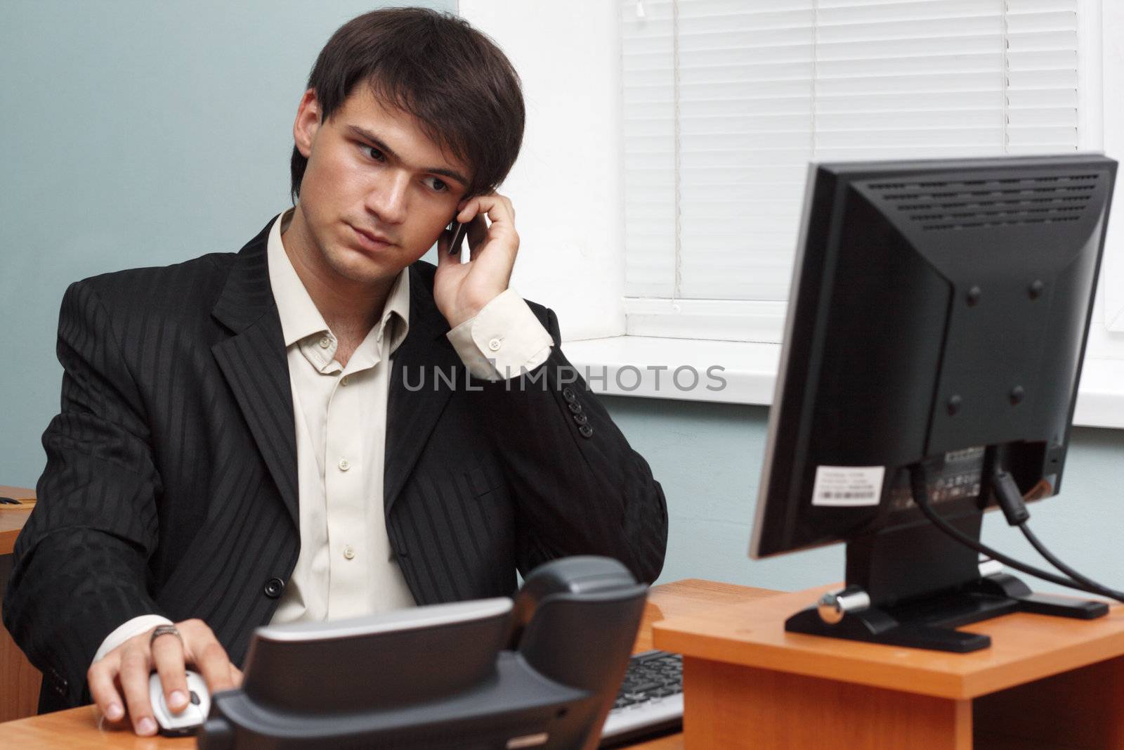 Young businessman making a phone call