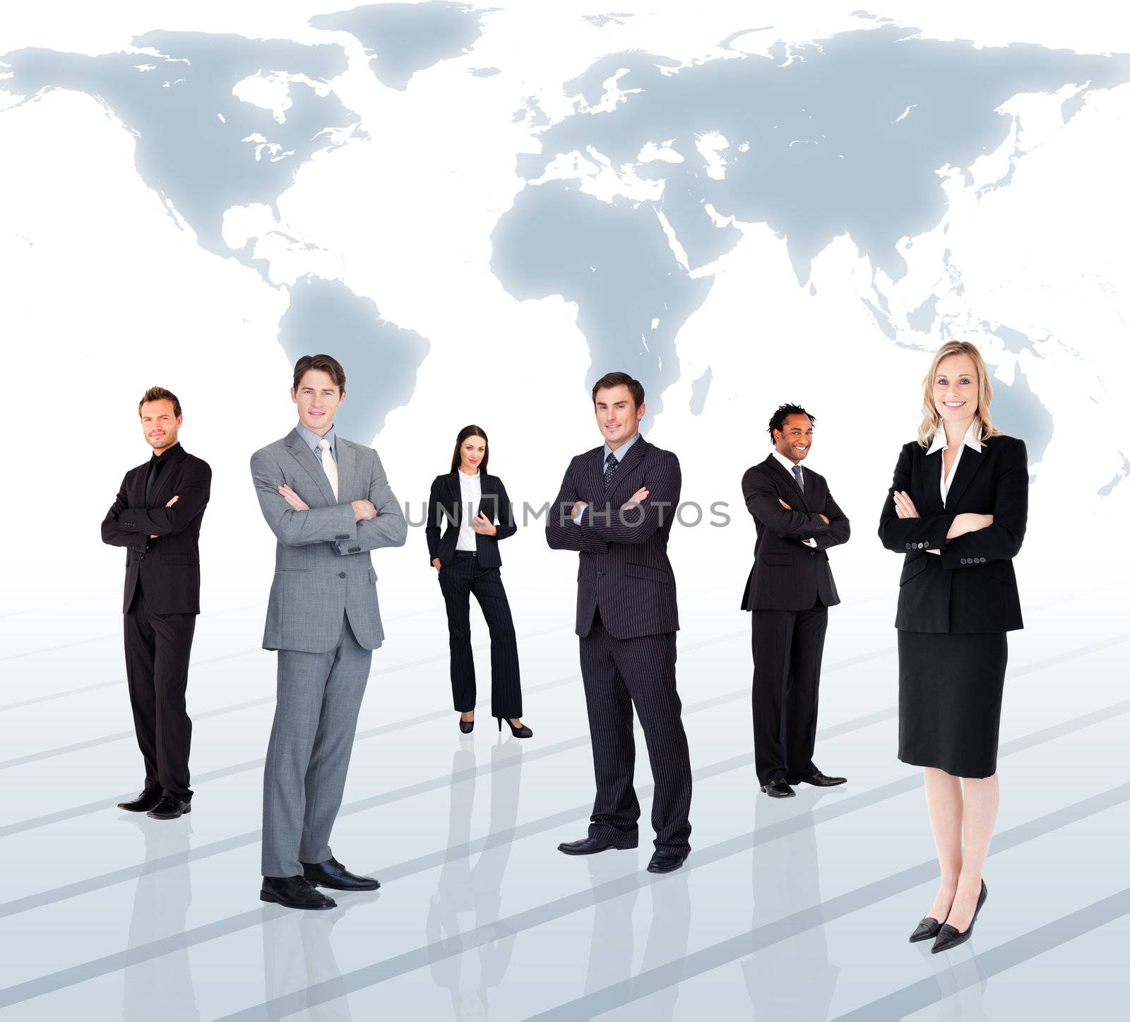Businesspeople standing against world map by Wavebreakmedia