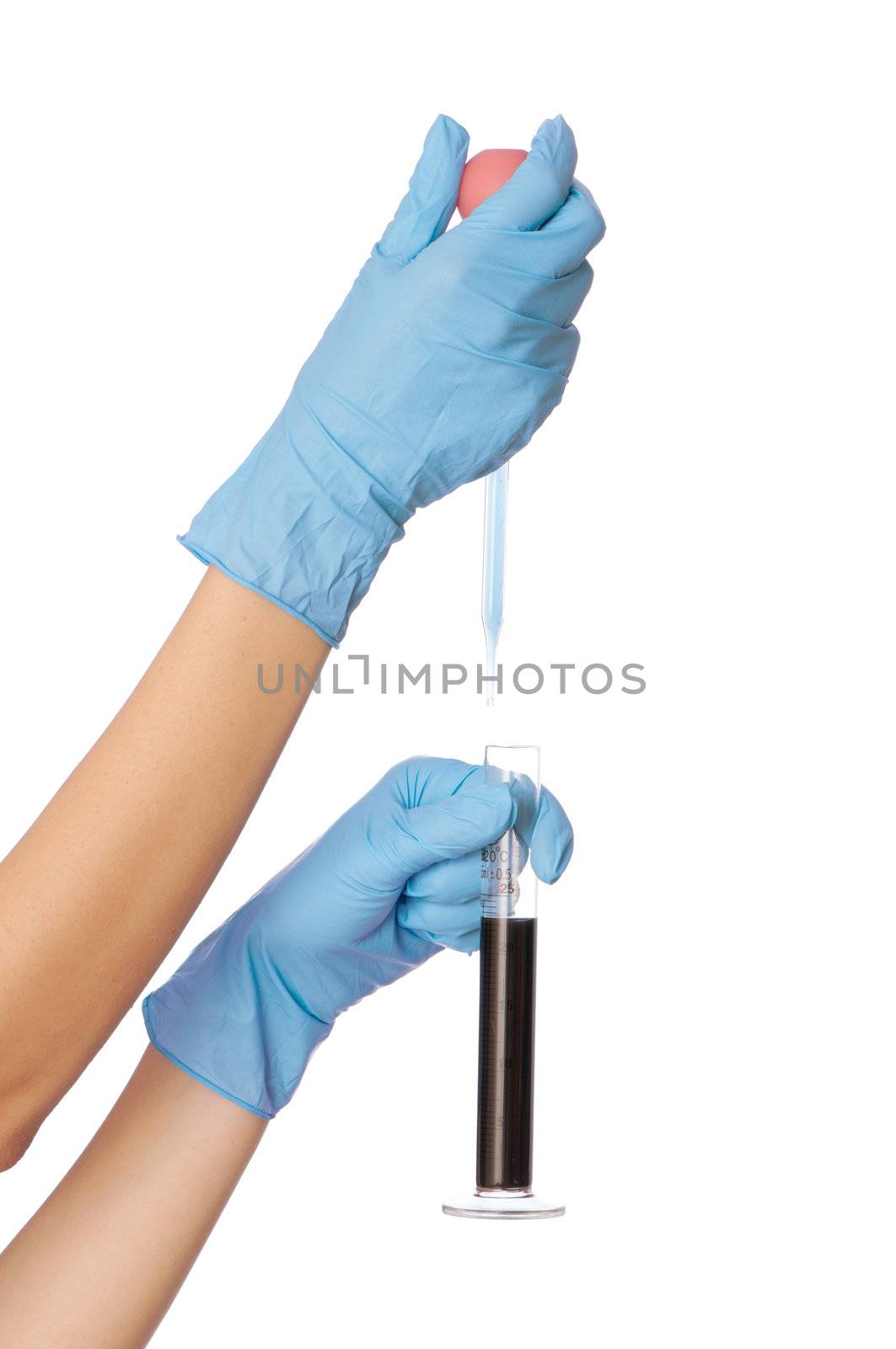 Woman in blue gloves holding sample of fractions of oil typed in a tube for experiments in the hand
