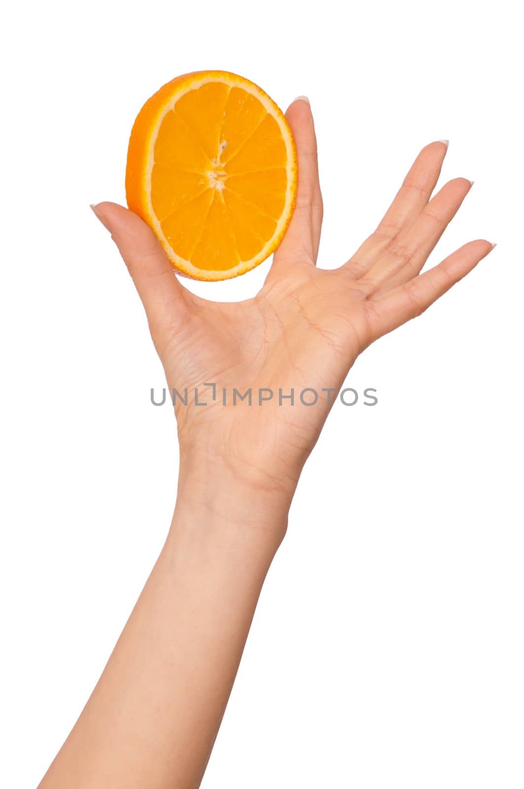 Slice of a fresh Sicilian orange in the hand