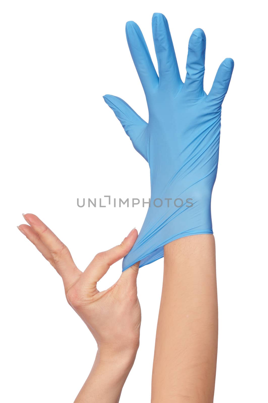 Doctor putting on blue sterilized medical glove for making operation