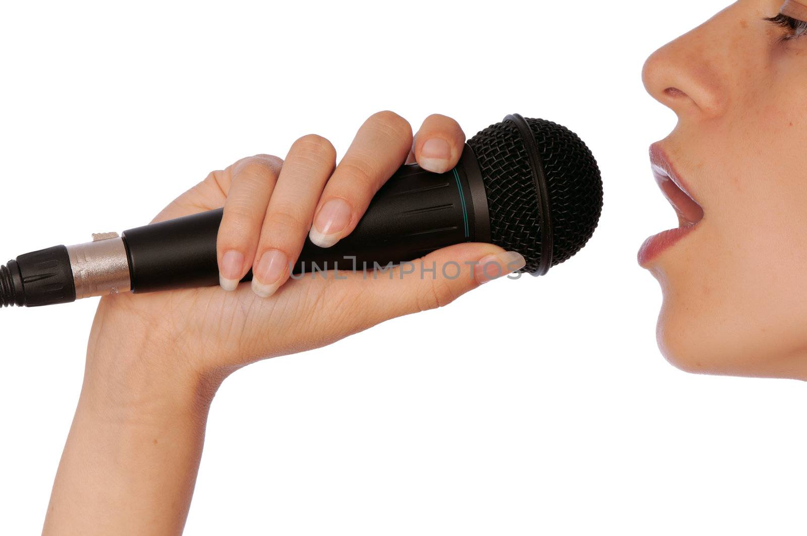 The singer sings a song in a microphone