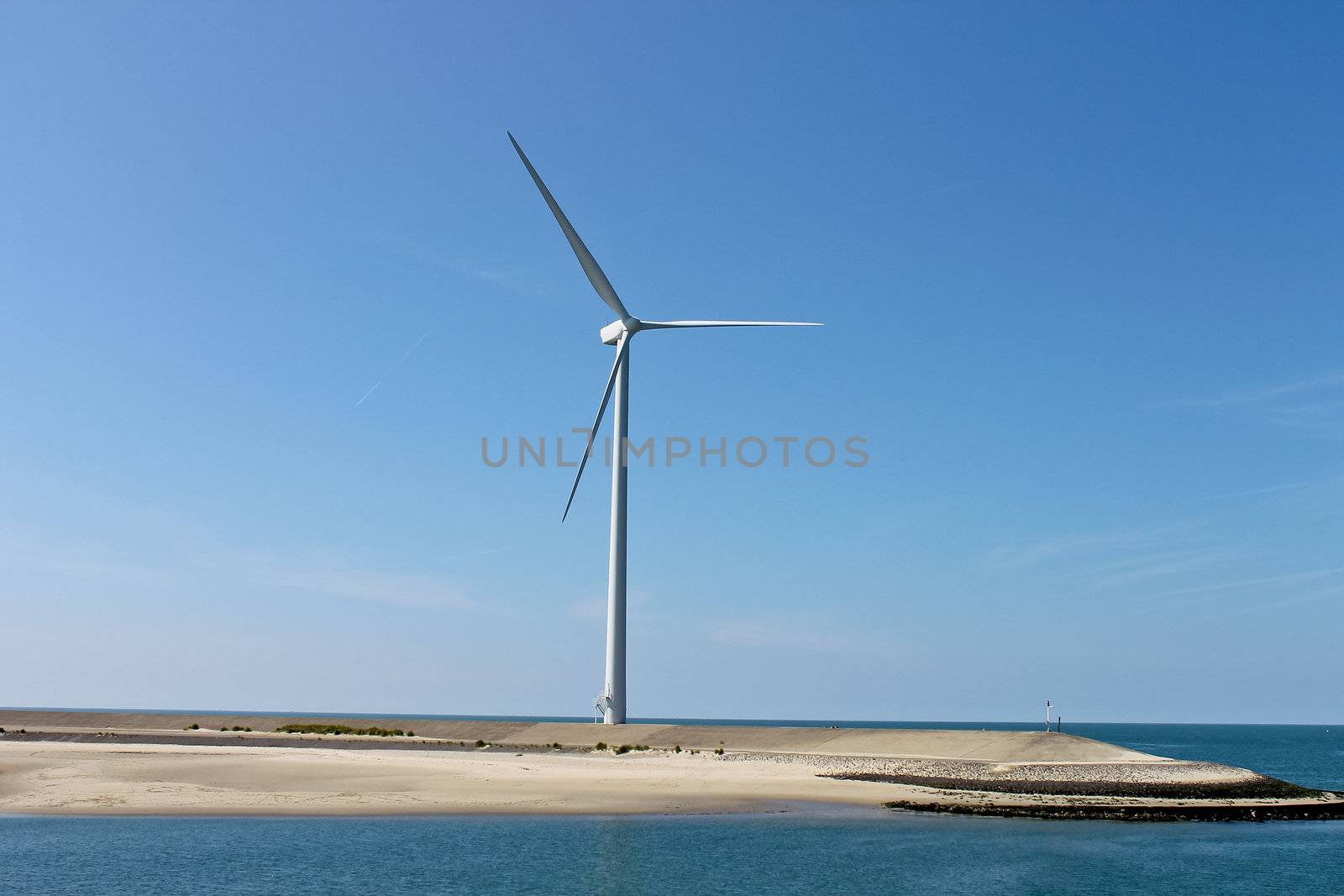 Dutch landscape. Wind turbines on the lake