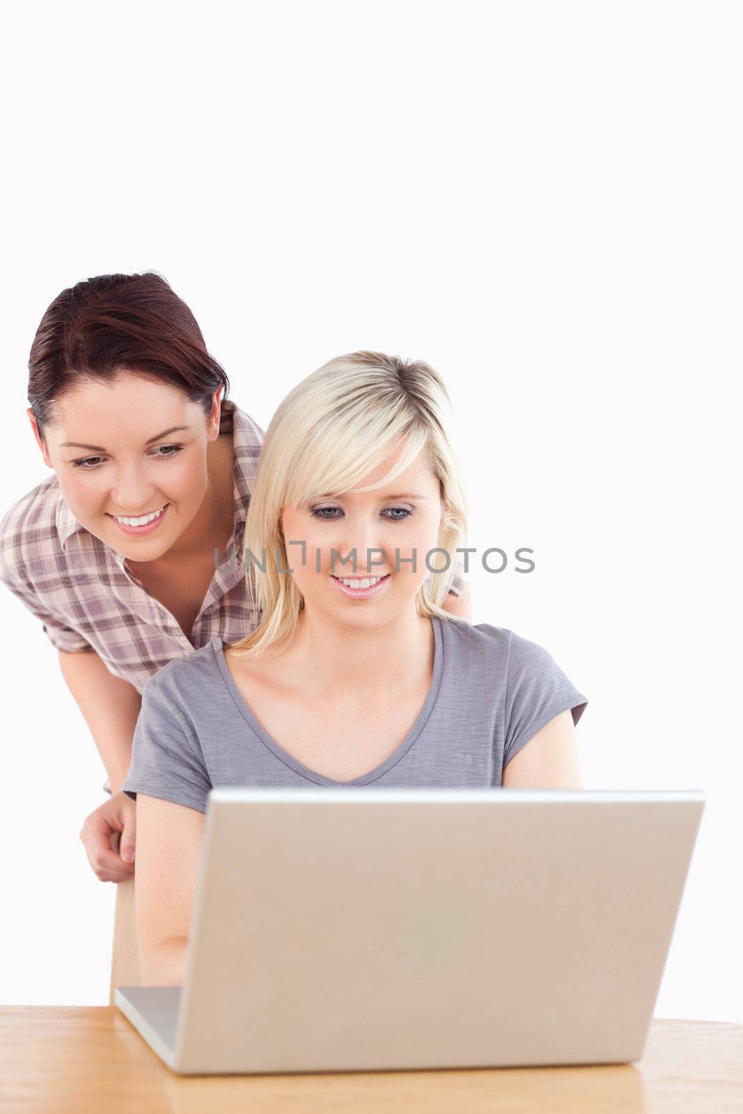 Beautiful women with a laptop in a studio